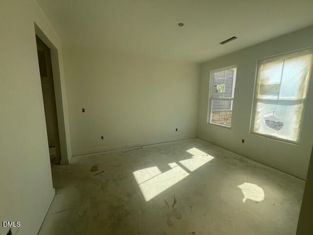Unfinished bedroom with two windows and natural light in new construction Davidson Homes Magnolia II B, Lillington NC