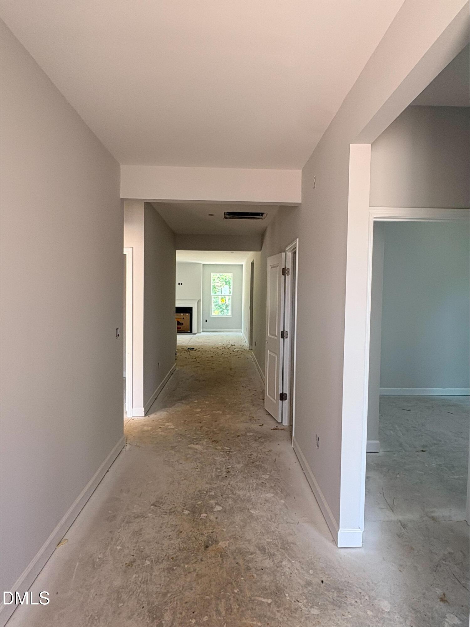 Open hallway leading to living area in new construction Daphne D floor plan by Davidson Homes in Zebulon, North Carolina.