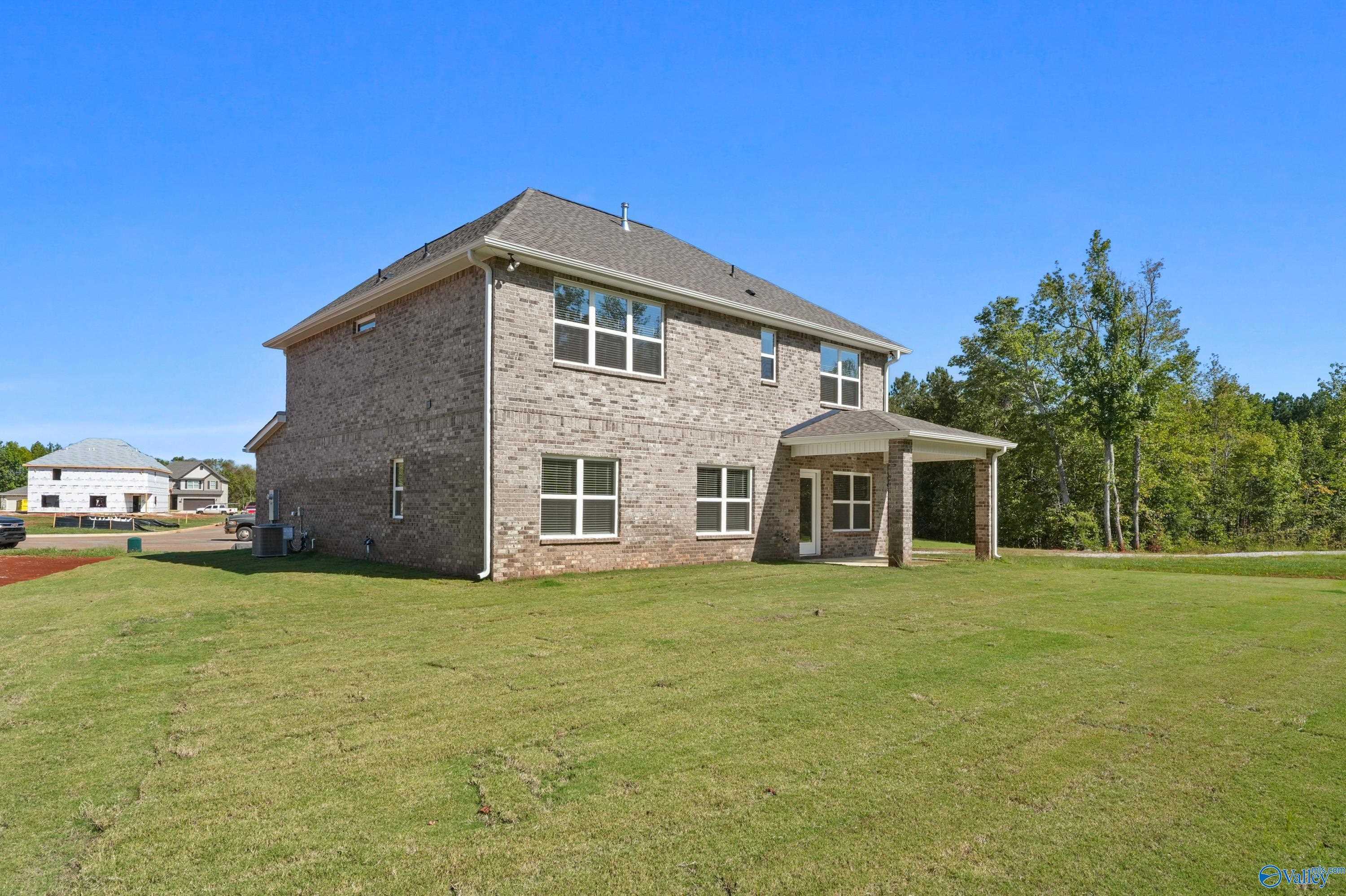 Two-story brick home with 2-car garage and covered entry in Ricketts Farm, Athens, Alabama - Davidson Homes Shelby A