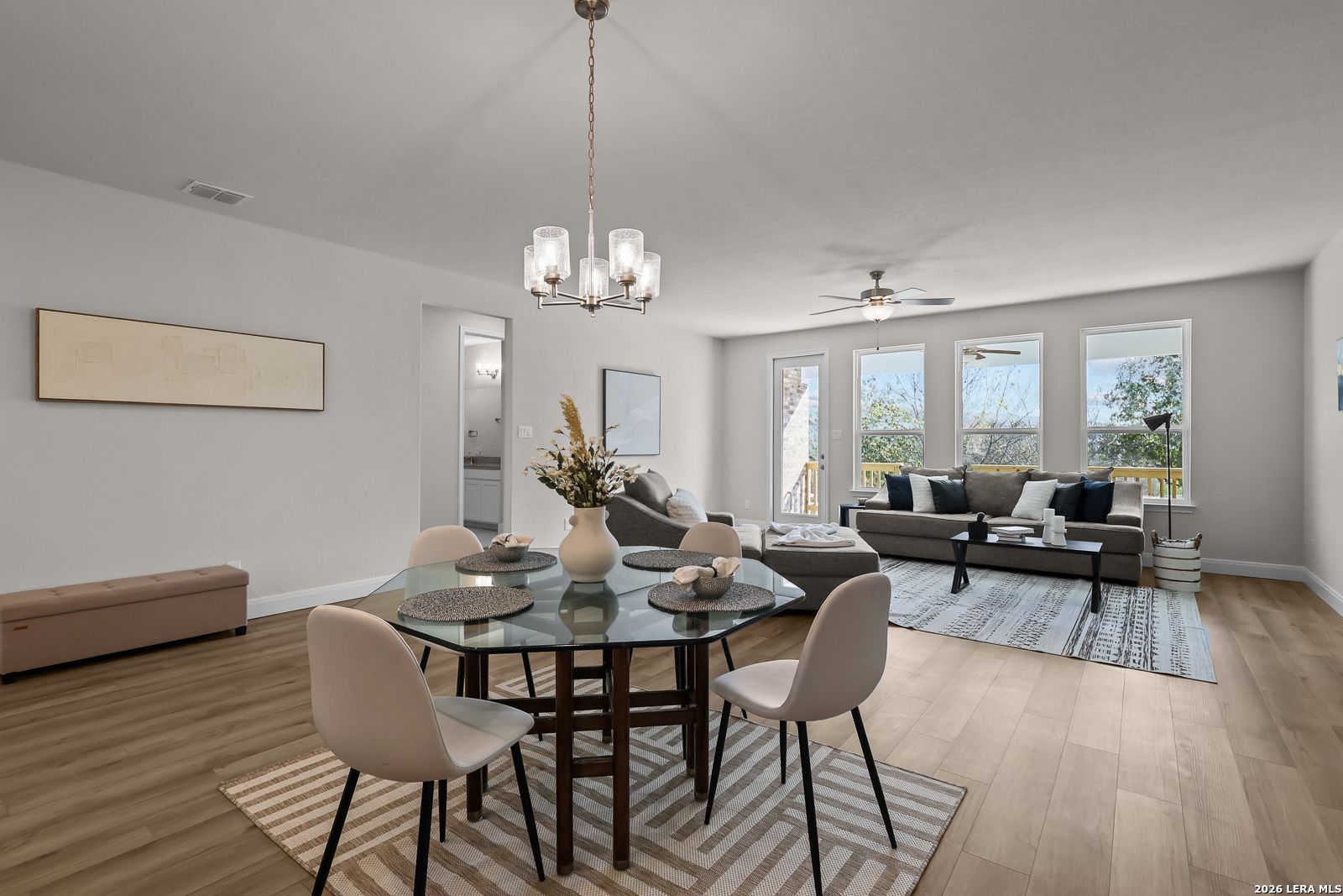 Open-concept dining and living area in The Lanier H floor plan at Davidson Homes in Ladera, San Antonio, Texas.