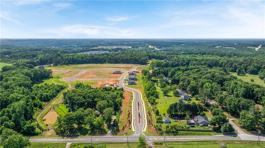 Aerial view of Cedar Farms community development by Davidson Homes in Winder, Georgia featuring new home construction.