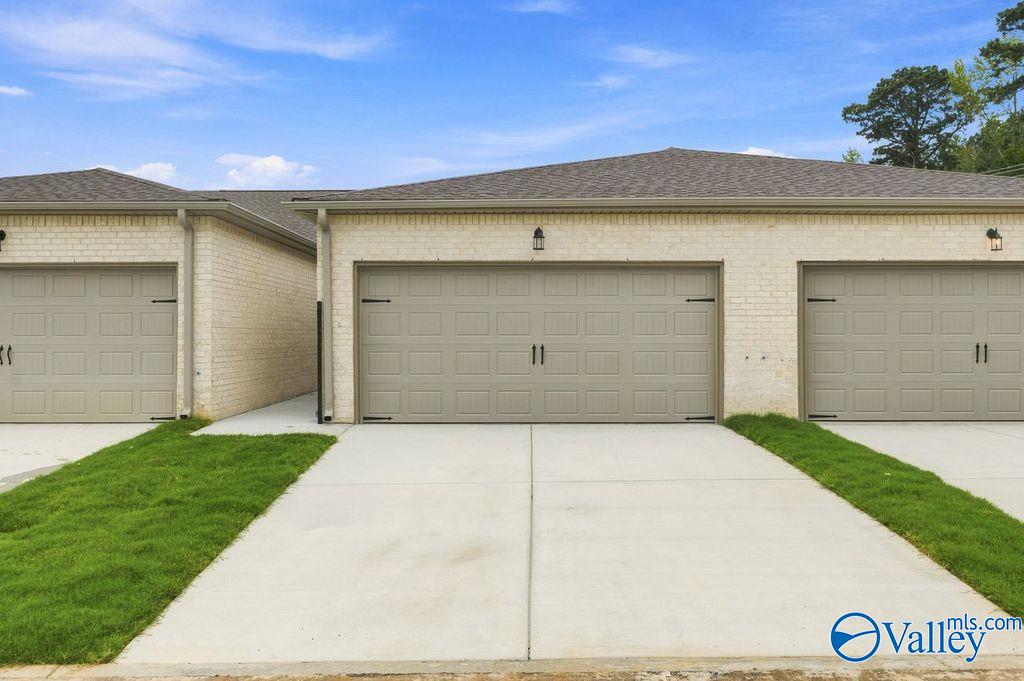 Exterior of 1-story Camilla C home with 2-car garage at The Retreat at Cain Park in Hartselle, Alabama.