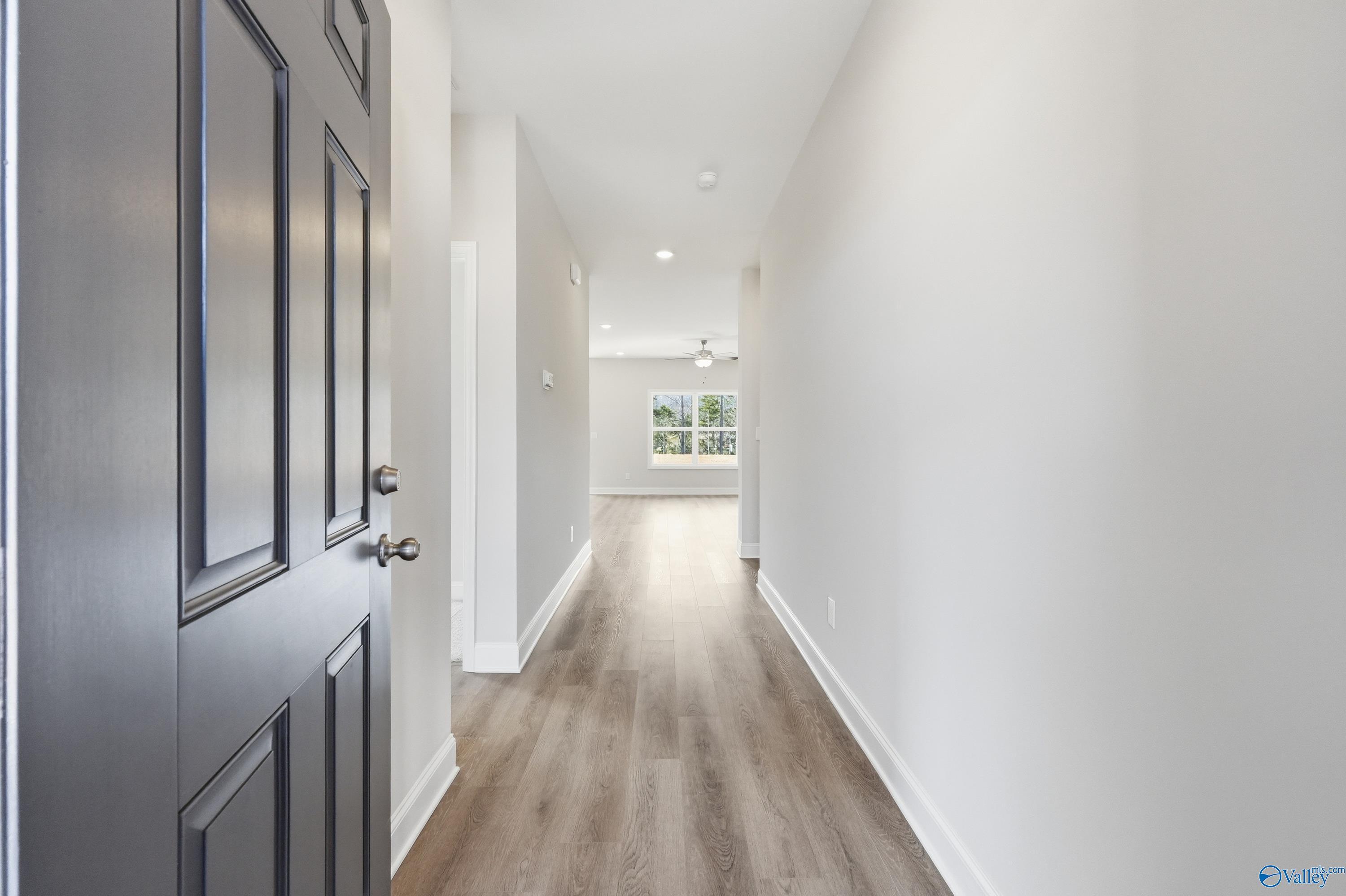 Welcoming entry hallway with light wood floors and natural light in Davidson Homes The Asheville C, Spragins Cove, Huntsville