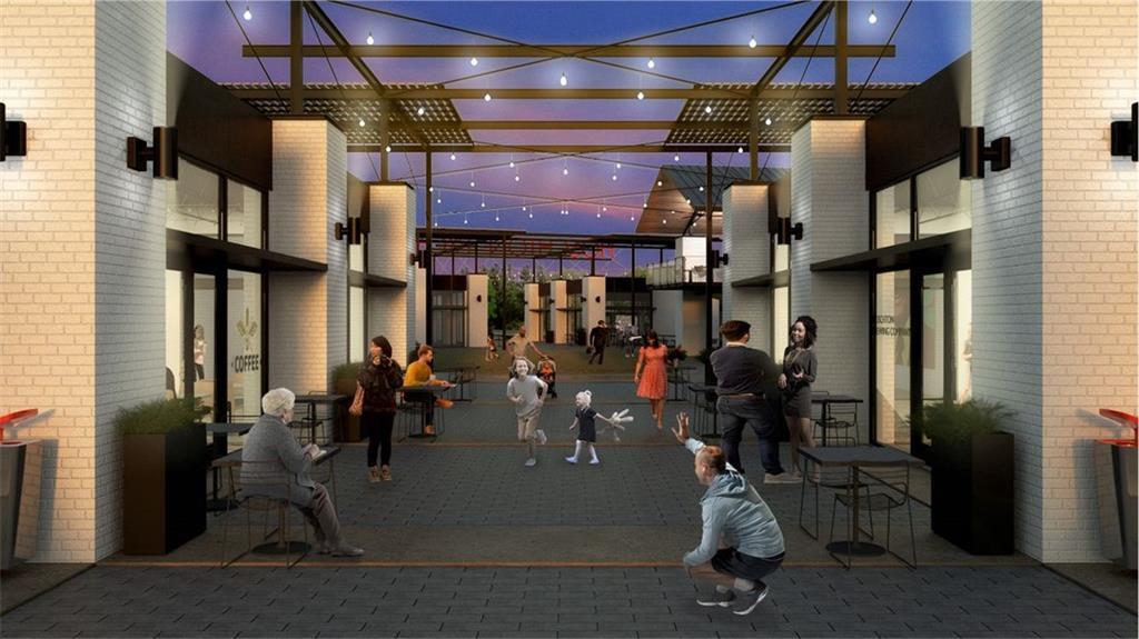 Lively twilight courtyard in Wehunt Meadows with people strolling under string-lit pergolas and modern white brick shops, Hoschton, Georgia