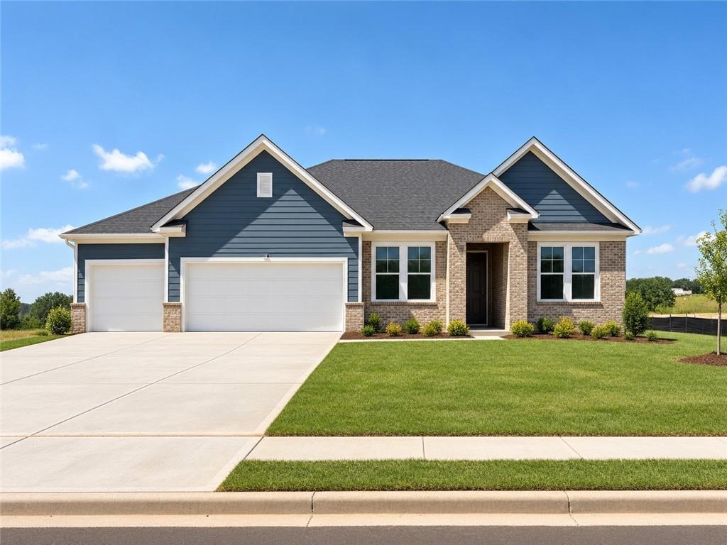 Front exterior of Davidson Homes The Harrison H, 4-bedroom ranch with 3-car garage in Wehunt Meadows, Hoschton, Georgia