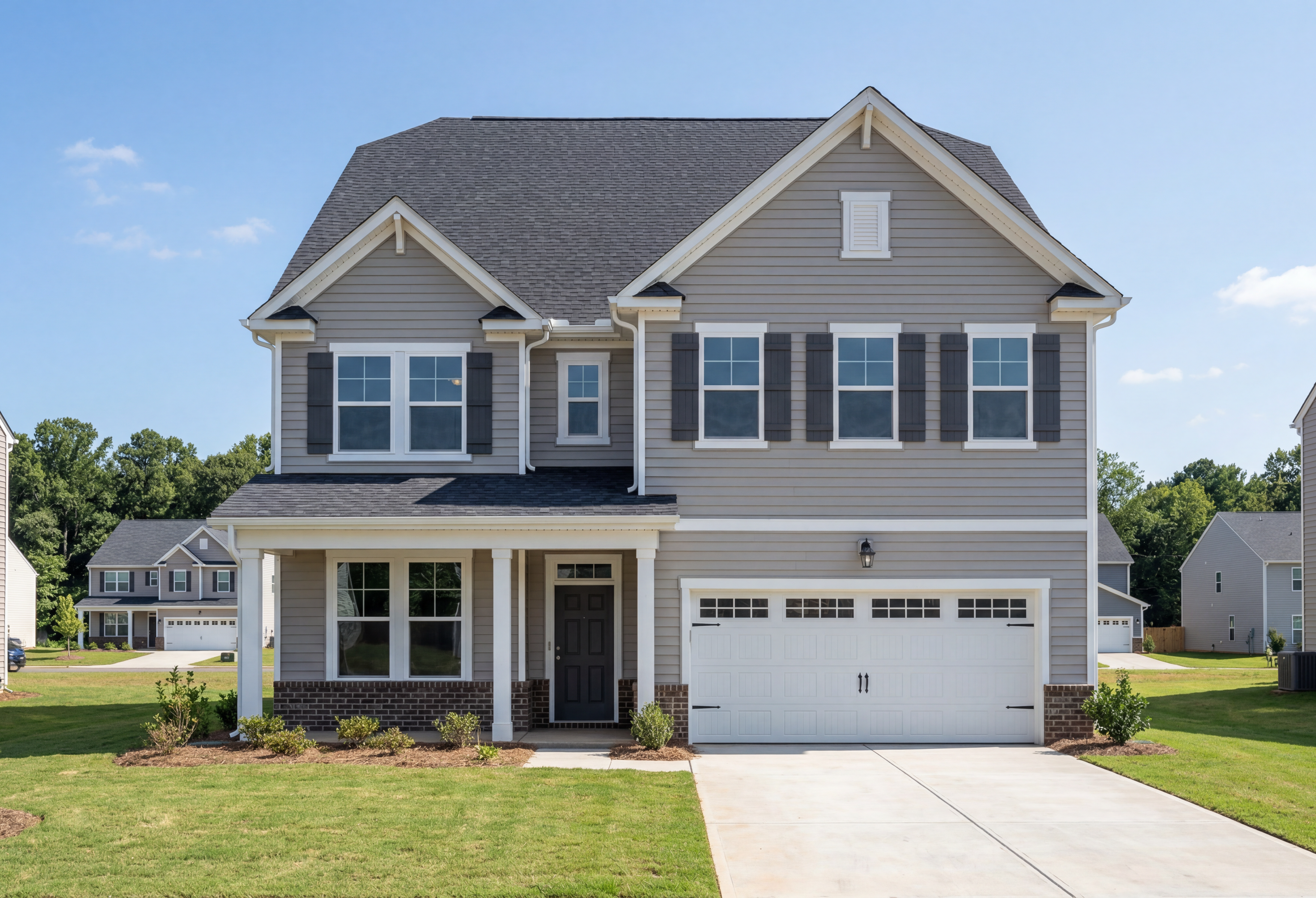 Modern two-story Aspen A home elevation with gray siding, black shutters, two-car garage, and covered porch in Belmont NC