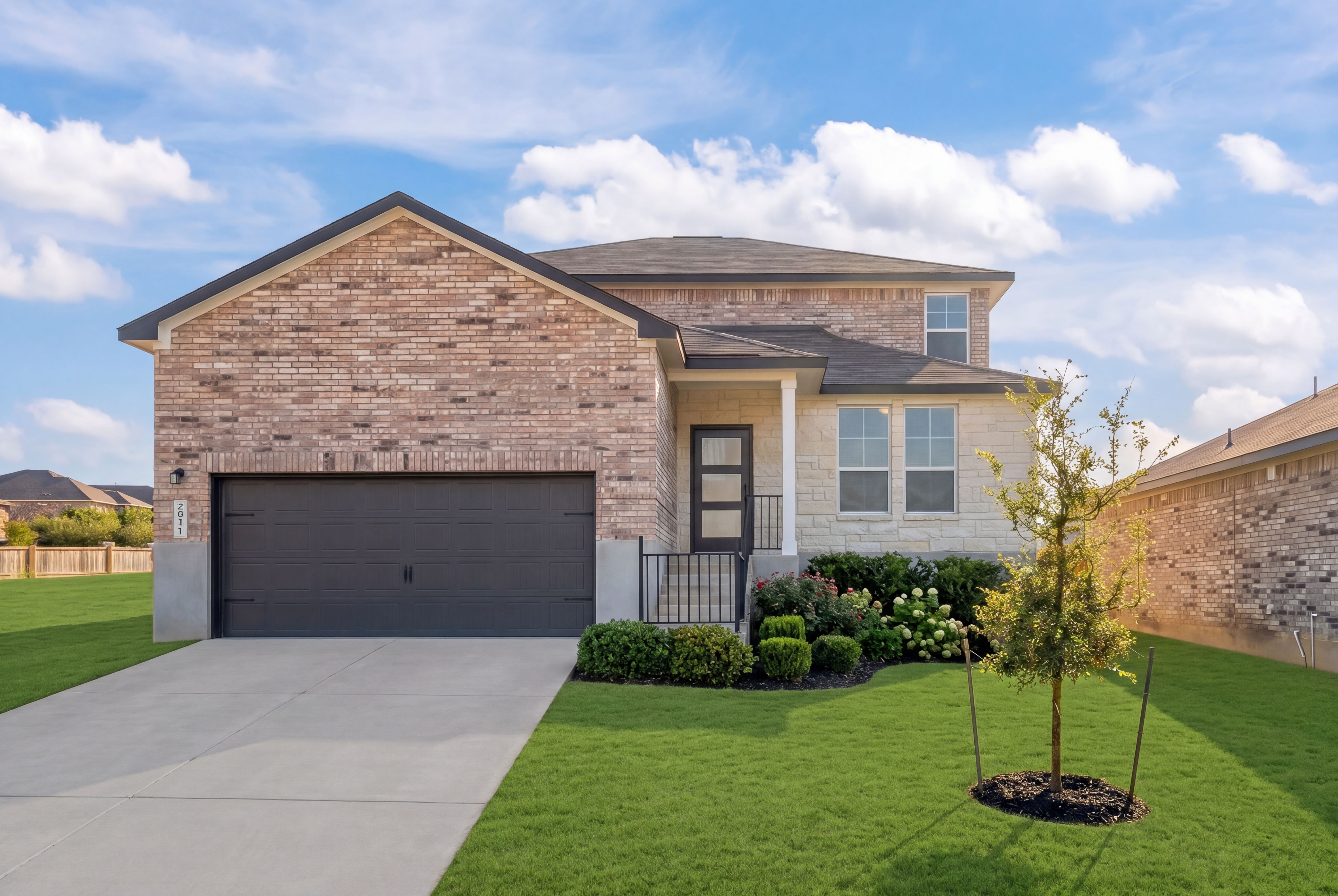 Brick and stone two-story home in Comanche Ridge