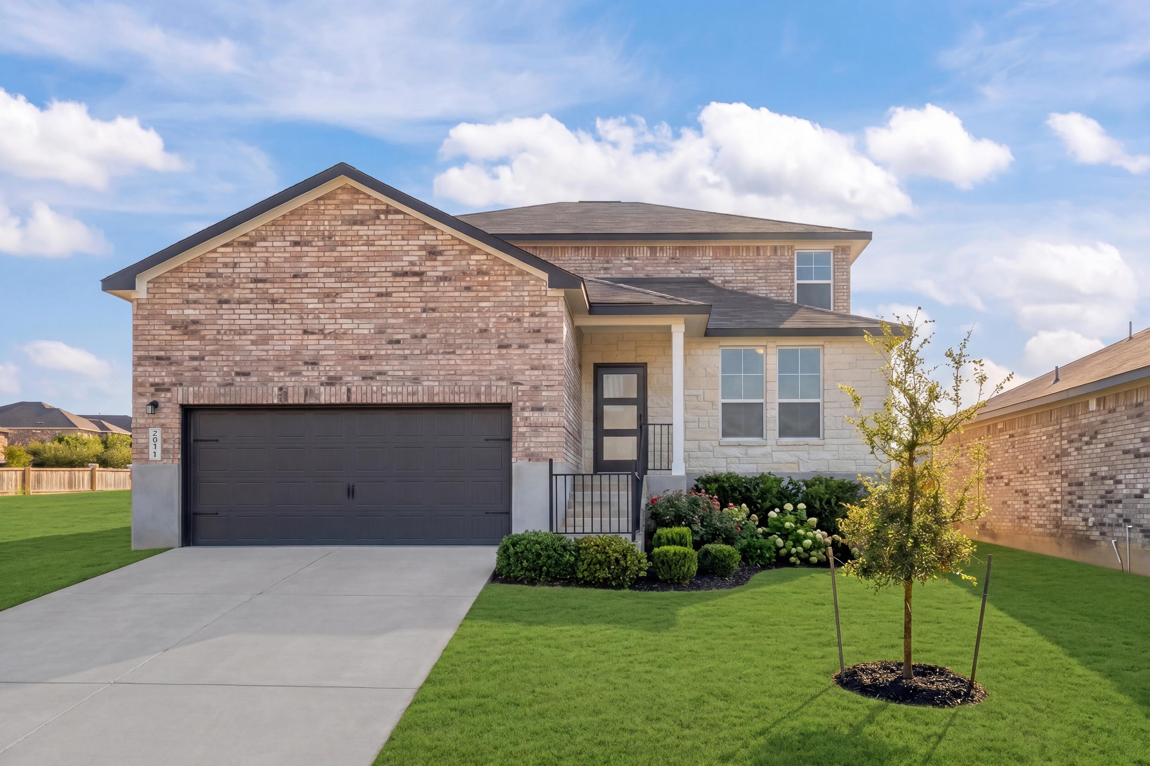 Brick and stone two-story home in Comanche Ridge