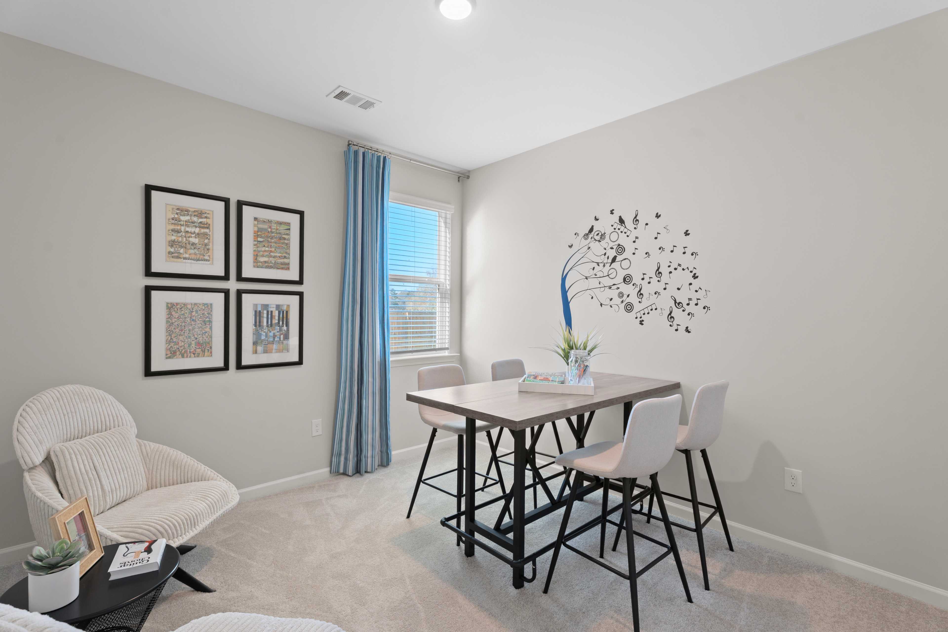 Secondary bedroom shown as a craft hobby room