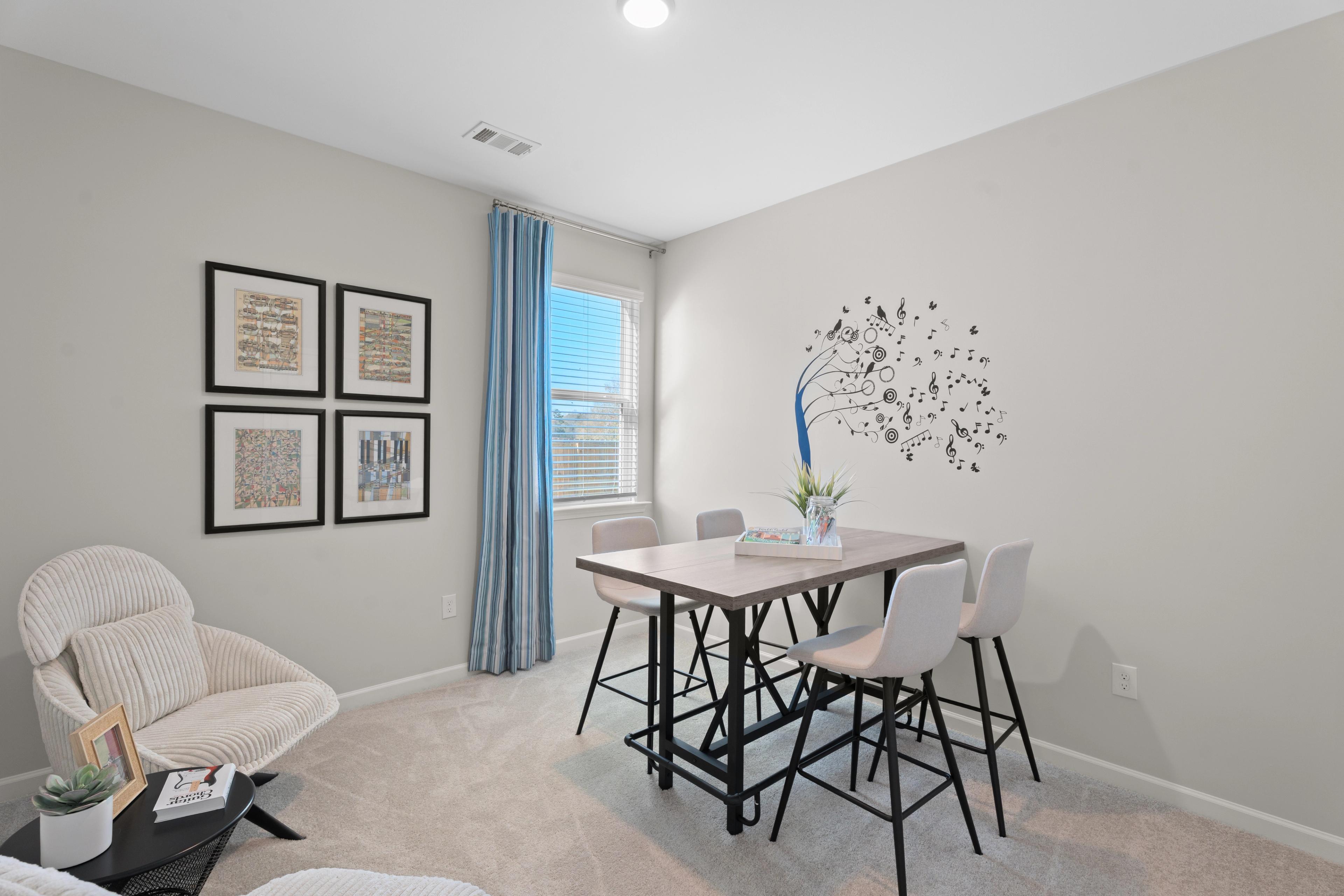 Secondary bedroom shown as a craft hobby room