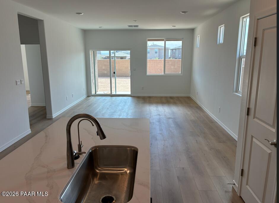 Open-concept kitchen and living area in The Coronado A floor plan, South Ranch Destination Collection, Prescott, Arizona.