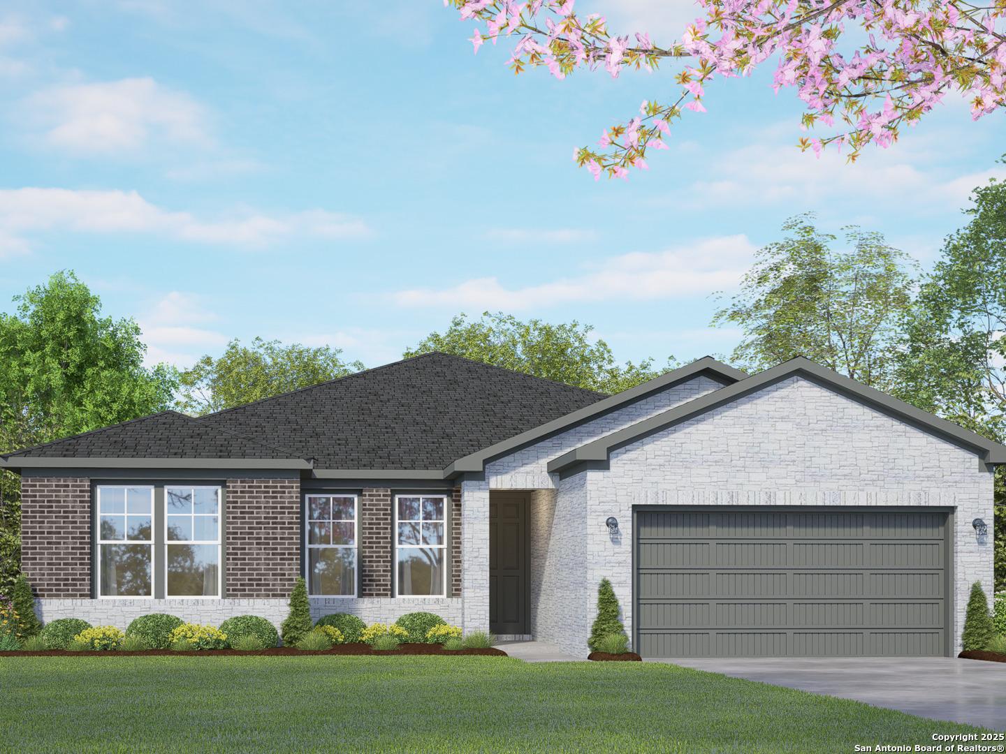 Modern single-story brick home with 2-car garage, white siding, and landscaped yard in Ladera, San Antonio - Davidson Homes The Rockford G