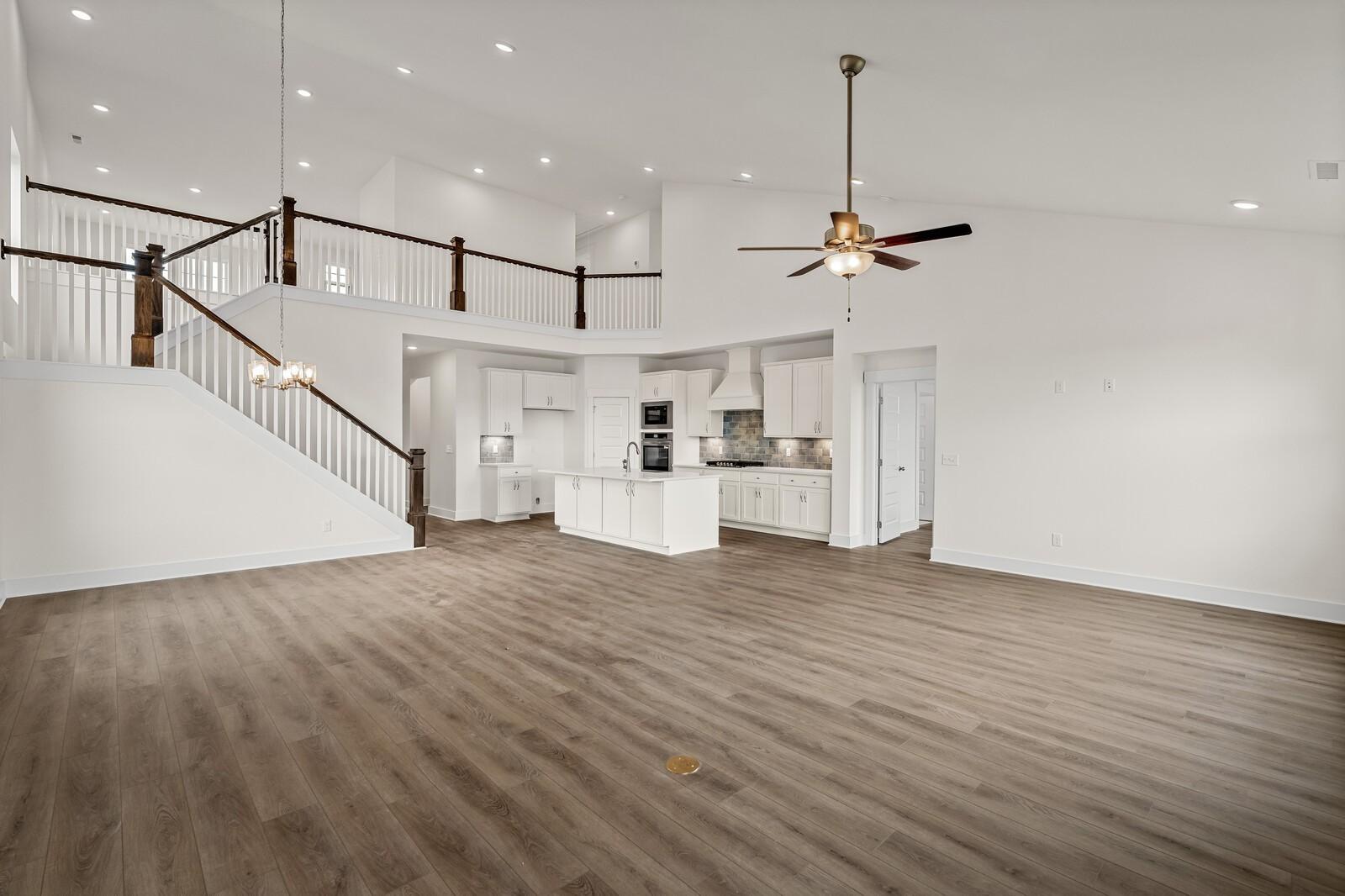 Open-concept living room and kitchen in The Ridgeport D floor plan by Davidson Homes in Benders Cove, Mt. Juliet, Tennessee.