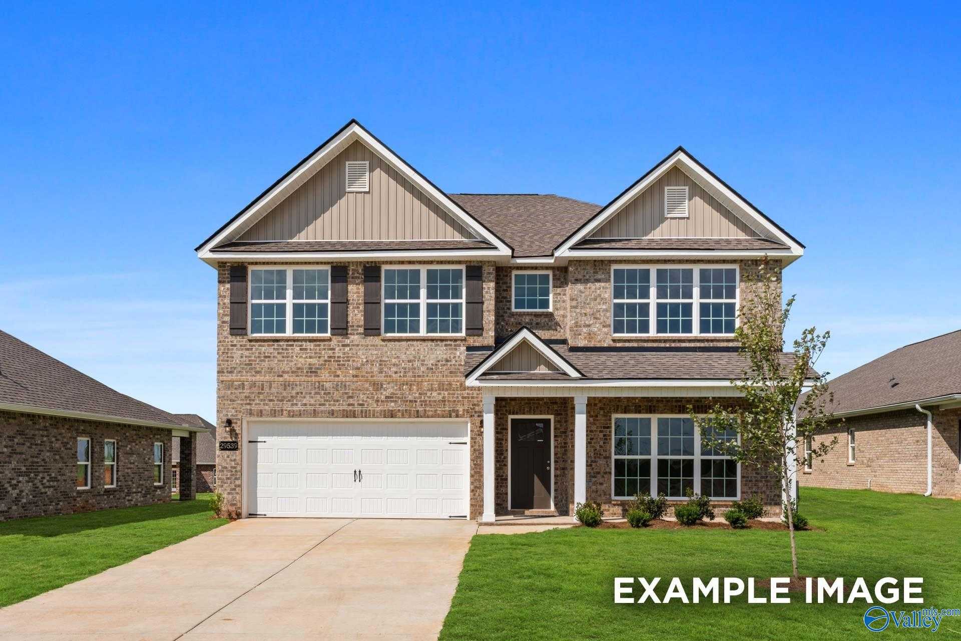 Modern single-story brick home with 2-car garage, front porch, and driveway in Jaguar Hills, Huntsville, Alabama - The Richmond D by Davidson Homes