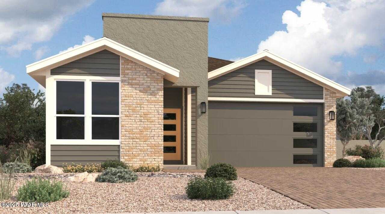 Modern single-story 3-bedroom home with brick facade, gray garage, large windows, desert landscaping in Prescott, AZ Davidson Homes Newport C