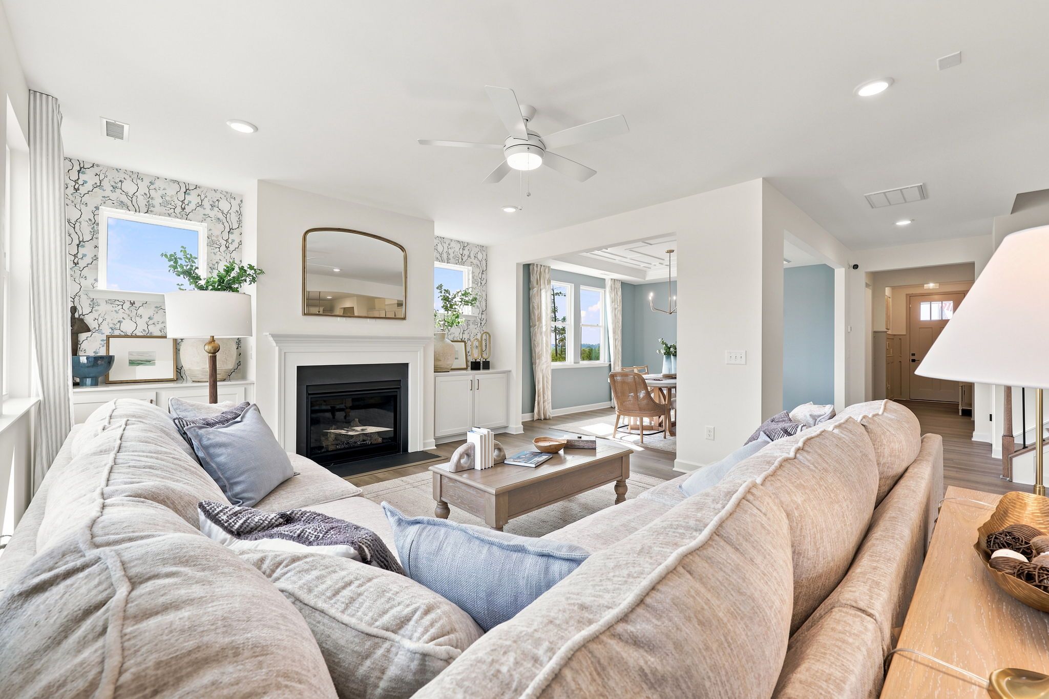 Spacious living room with fireplace at Montrose in Aberdeen, NC, featuring open-concept design by Davidson Homes.