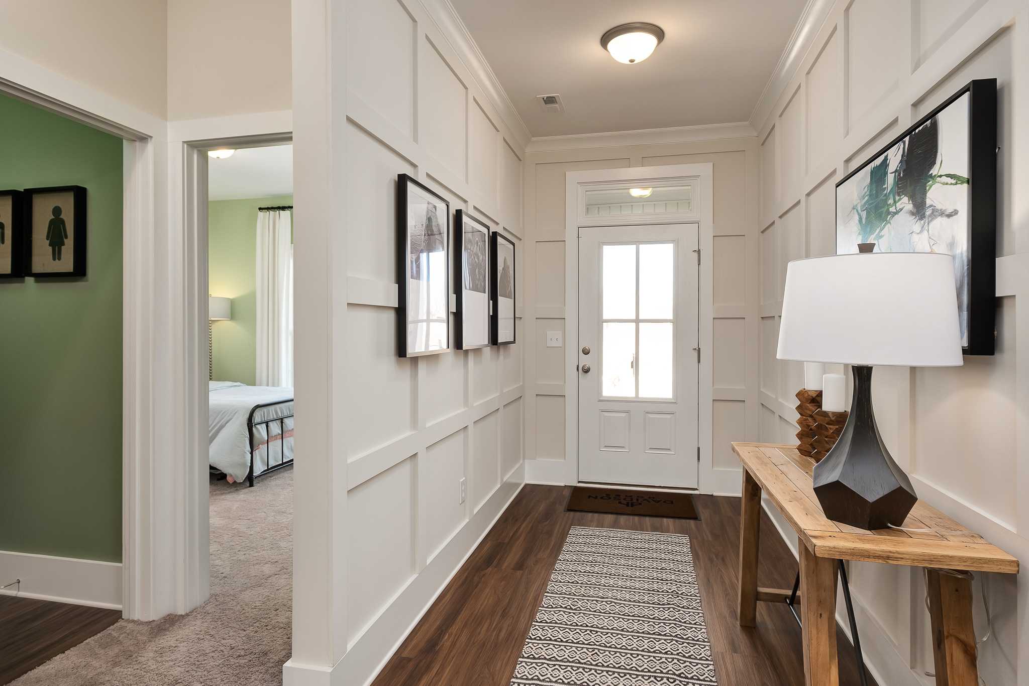 inviting foyer with judges paneling by Davidson Homes