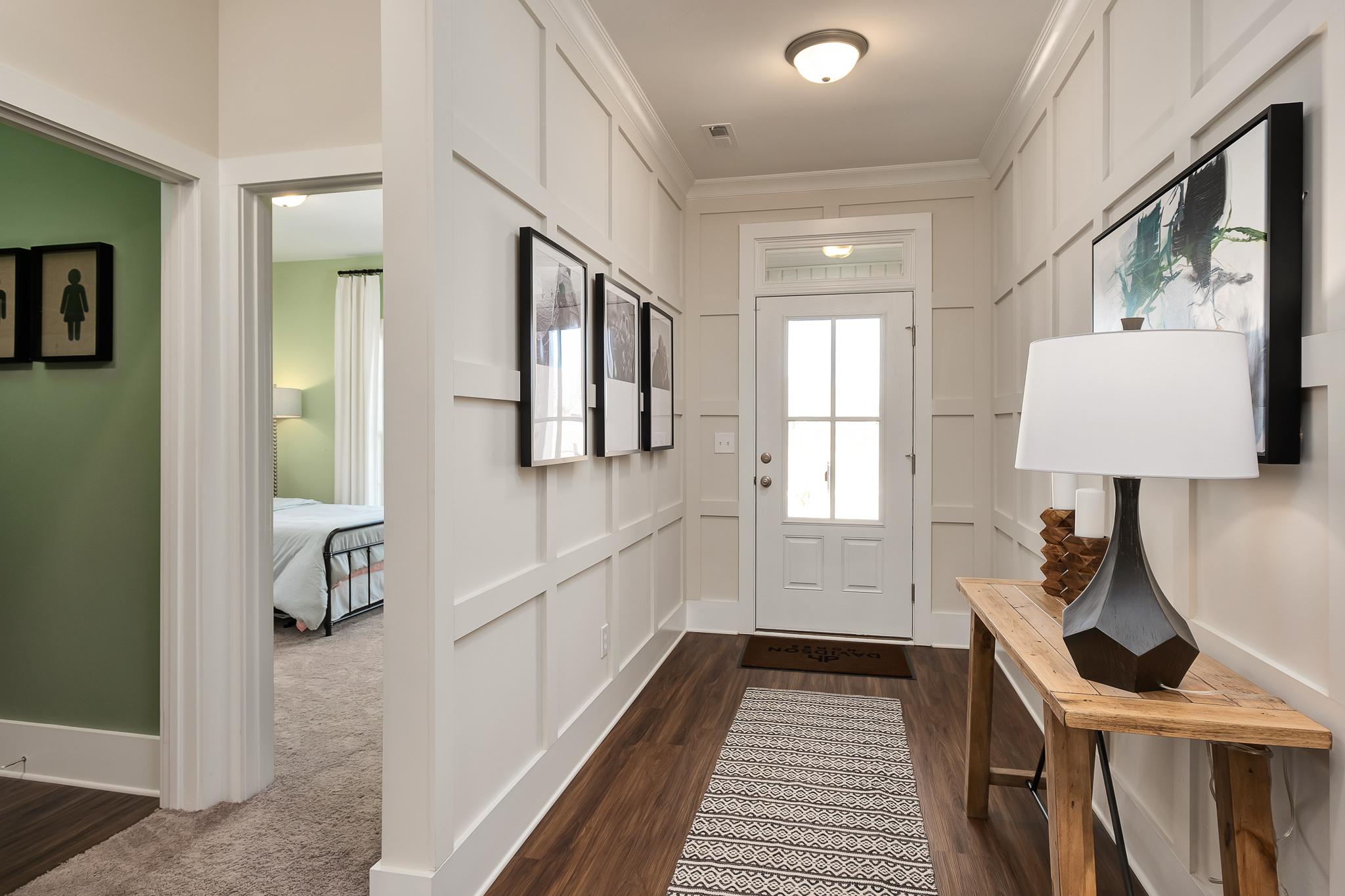 inviting foyer with judges paneling by Davidson Homes