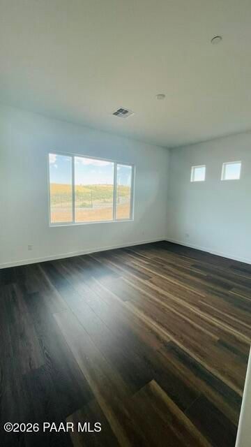 Bright, spacious living area with hardwood floors in The Aurea C floor plan at Hidden Hills, Prescott, Arizona.