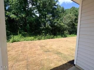 Private backyard view from The Daphne D home at Woodland Crossing in Zebulon, North Carolina.