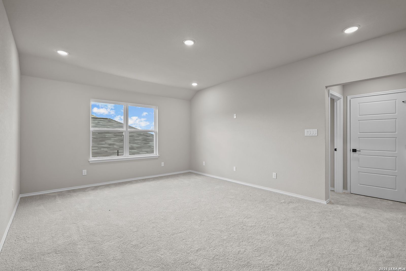 Spacious empty bedroom with carpet flooring, recessed lighting, and large window in Davidson Homes The Sequoia C, Royal Crest San Antonio