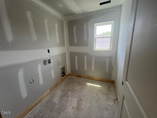 Unfinished laundry room with drywall and utility hookups in The Gavin C floor plan at Gregory Village in Lillington, NC.