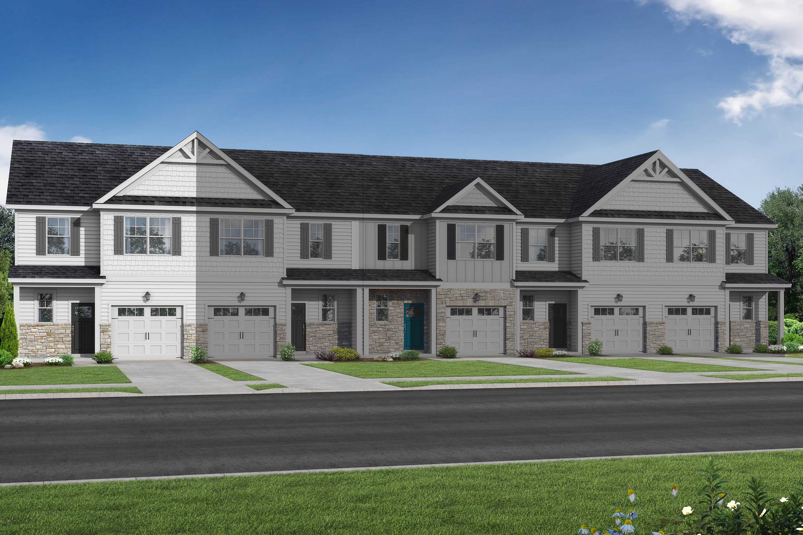 Row of four 2-story The Warren townhomes in Fuquay-Varina, NC, with white siding, dark gabled roofs, 1-car garages, porches, and lush green landscaping