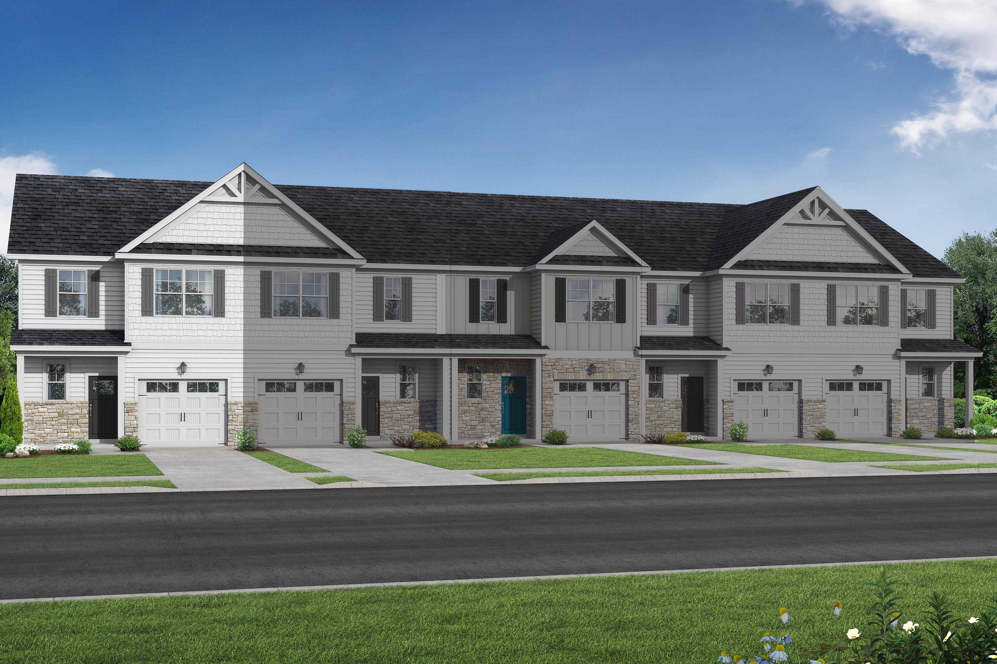 Row of four 2-story The Warren townhomes in Fuquay-Varina, NC, with white siding, dark gabled roofs, 1-car garages, porches, and lush green landscaping