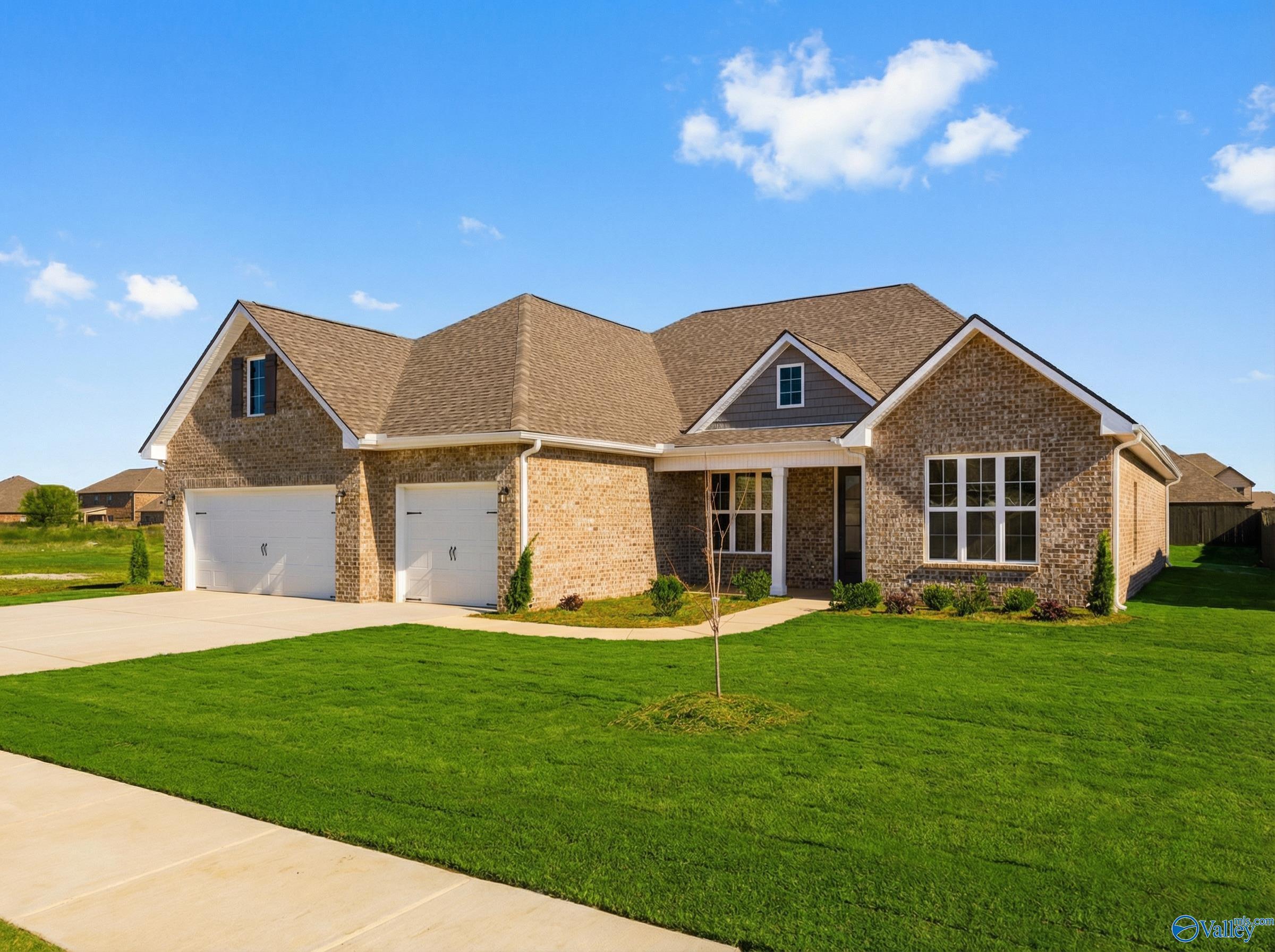 Brick single-story home with gabled roof, 2-car garage, and front porch in Briercreek, Meridianville, Alabama by Davidson Homes