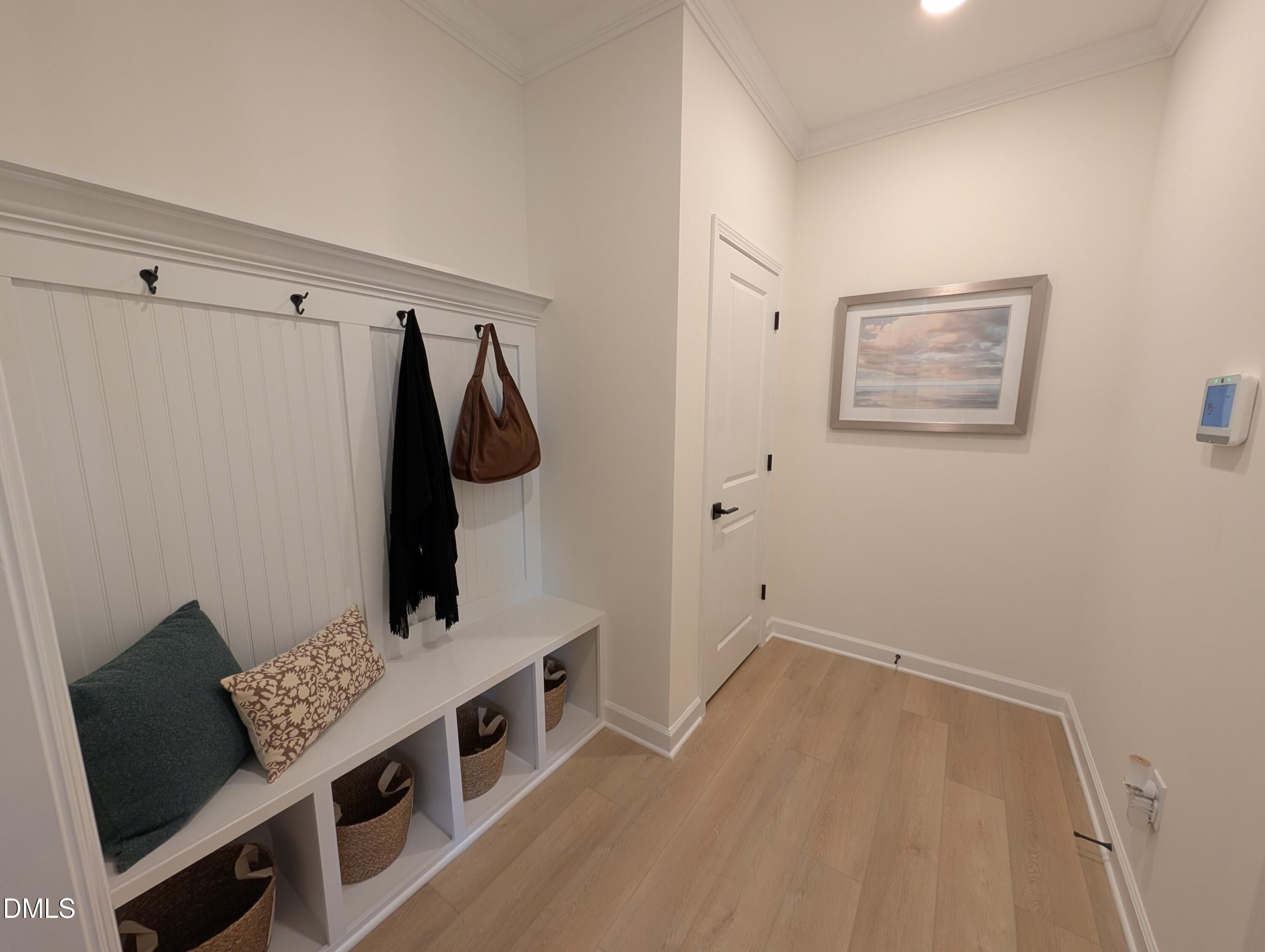 Mudroom bench with storage cubbies and coat hooks in The Aspen B floor plan at Wendell Ridge in Wendell, North Carolina.