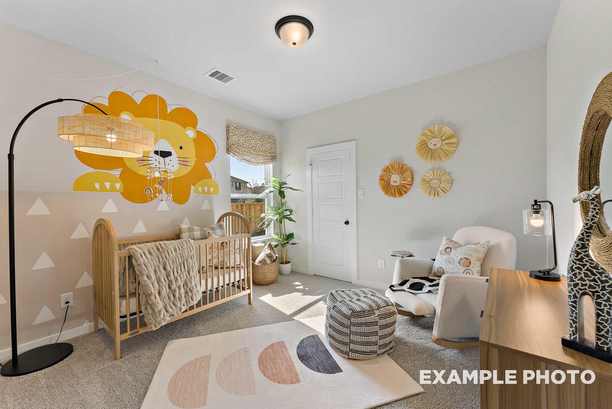 Whimsical nursery with lion wall mural and crib in The Everett E floor plan by Davidson Homes in Sundance Cove, Crosby, TX