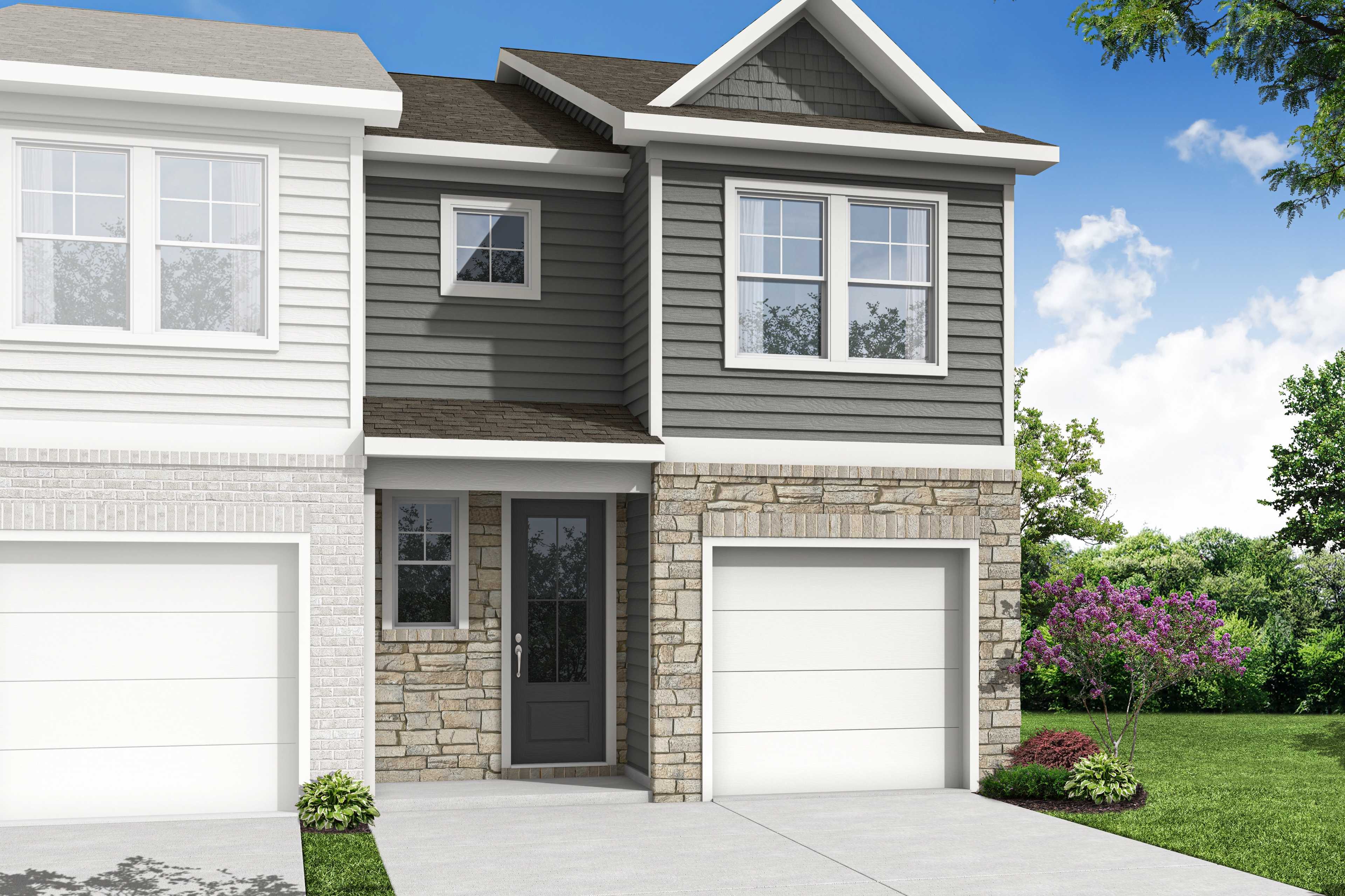 Modern two-story duplex elevation of The Durant B with gray siding, stone facade, double garages, and lush landscaping