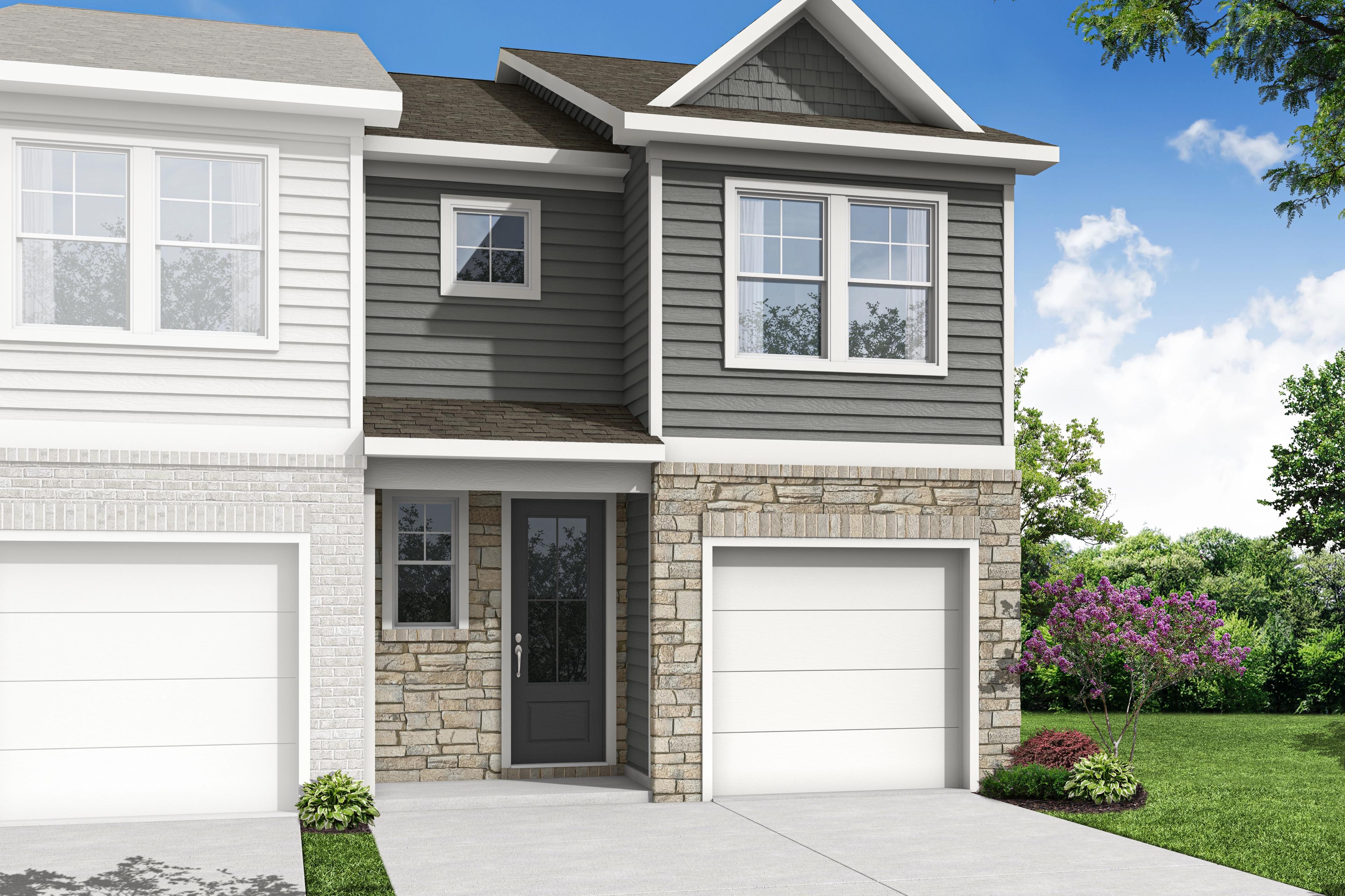 Modern two-story duplex elevation of The Durant B with gray siding, stone facade, double garages, and lush landscaping