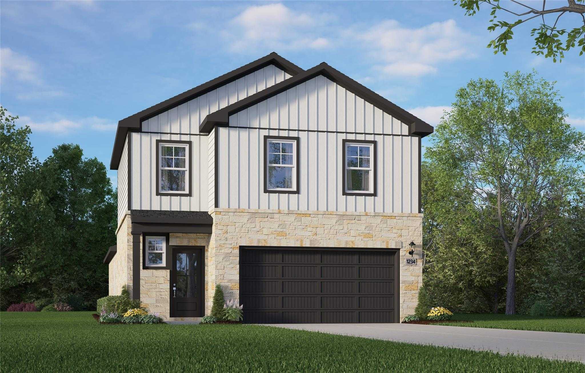 Modern two-story Blanco E home by Davidson Homes in Lakes at Black Oak, Magnolia, Texas, featuring white siding, stone facade, and two-car garage