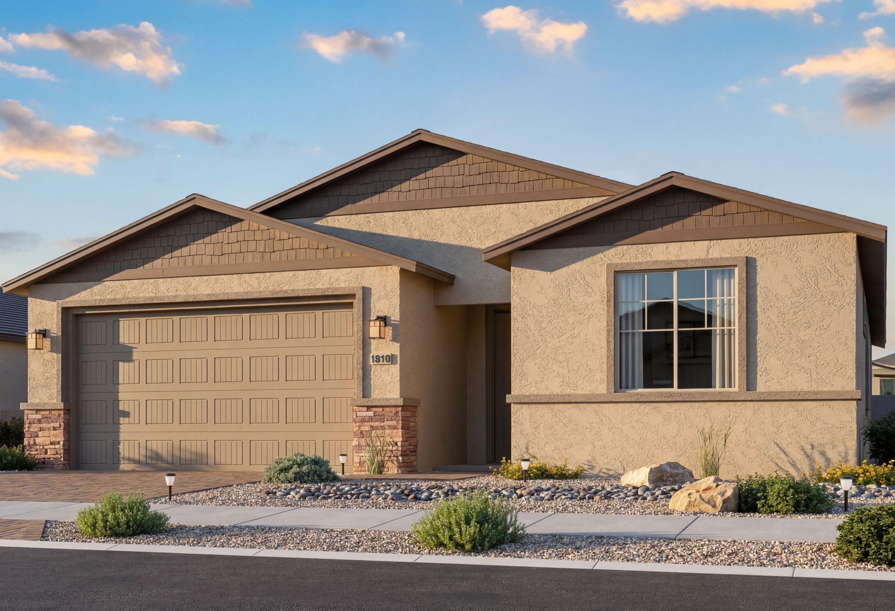 The Inspiration single-story home elevation featuring a 2-car garage, stucco exterior, and stone accents in Prescott Valley.