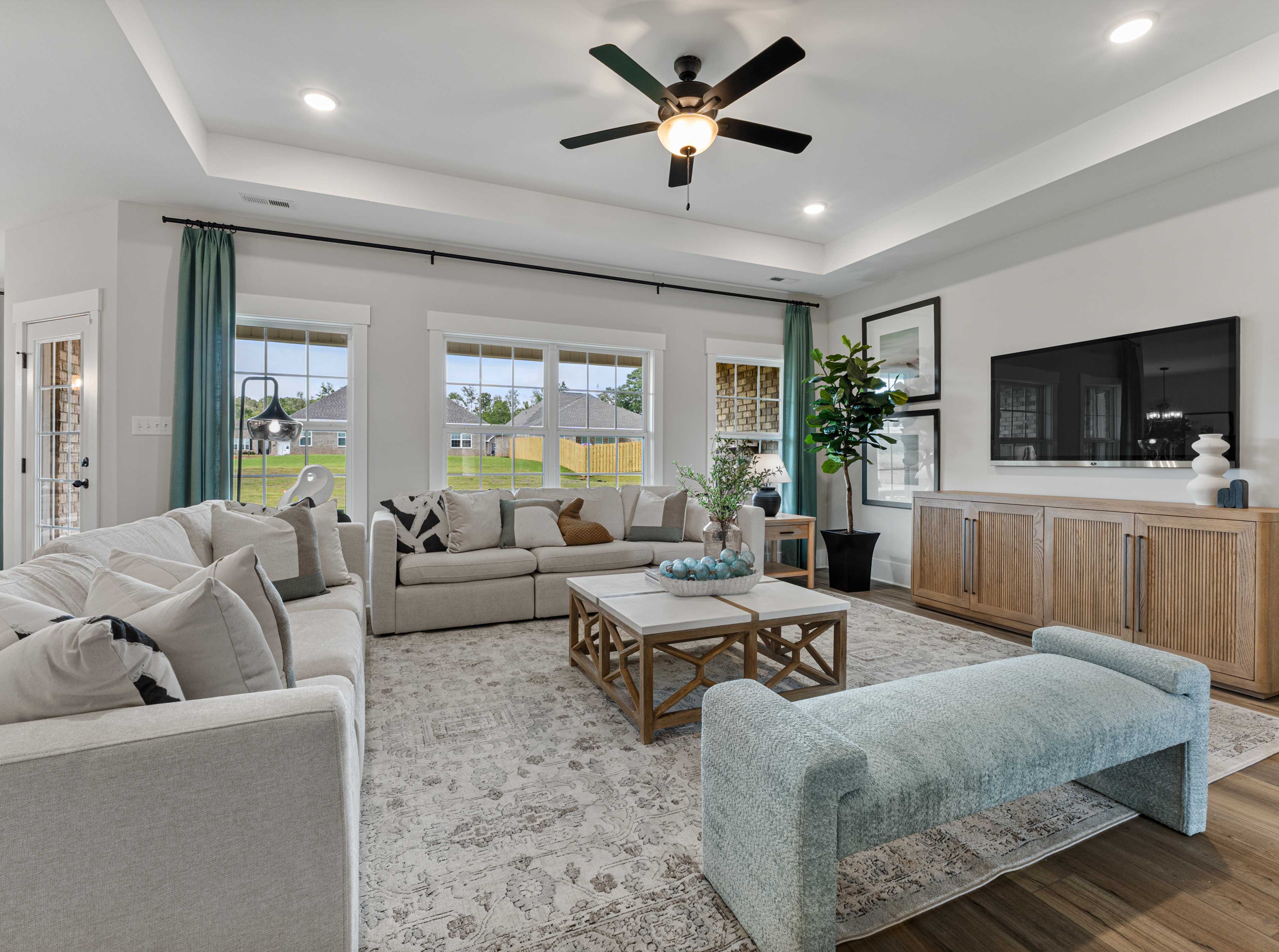 gracious kitchen with walk-in pantry and large center island by Davidson Homes in Decatur, AL