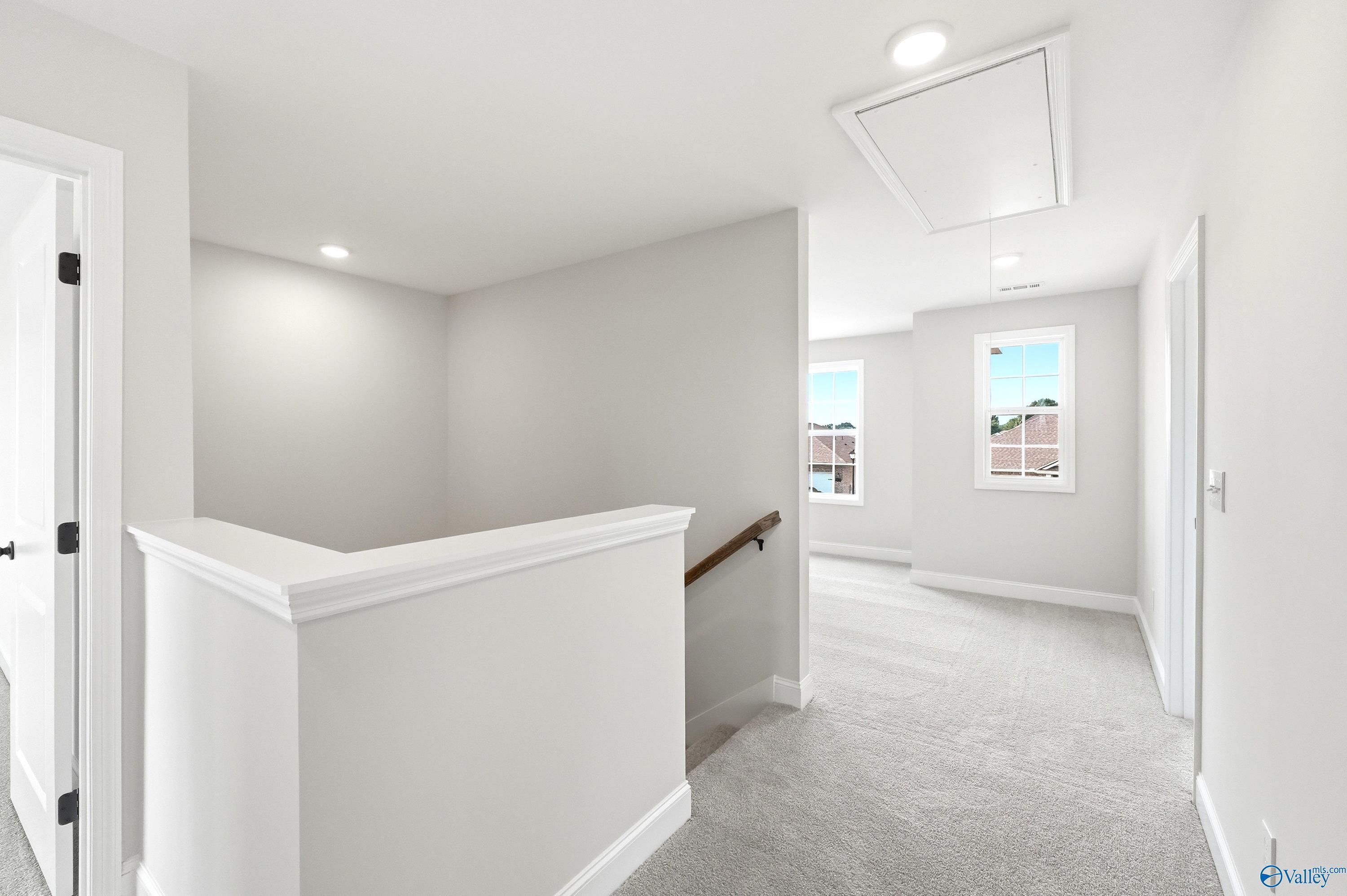 Bright carpeted upper landing in The Shelby A floor plan by Davidson Homes in Clearview, Hazel Green, Alabama.