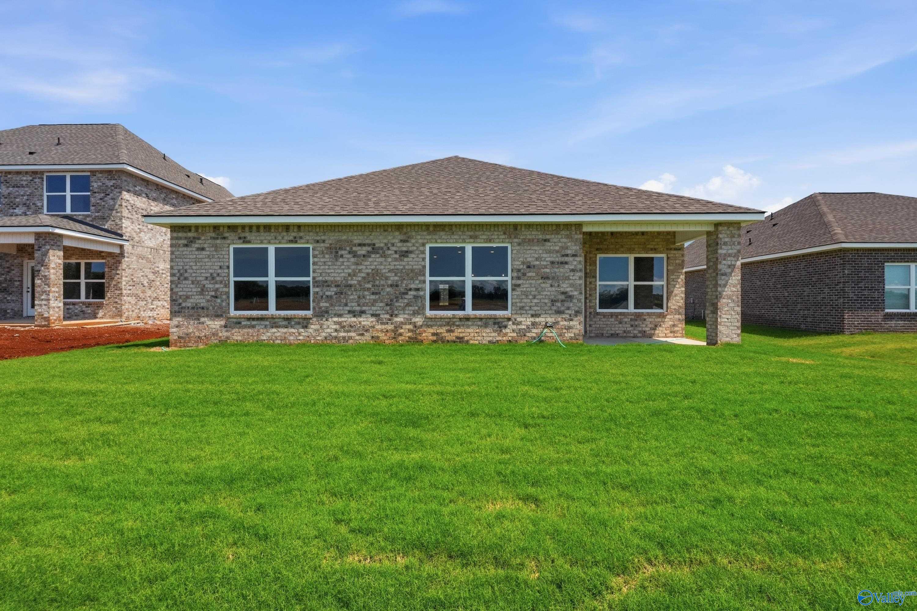 Rear view of The Daphne floor plan by Davidson Homes with a covered patio in Clearview, Hazel Green, Alabama.