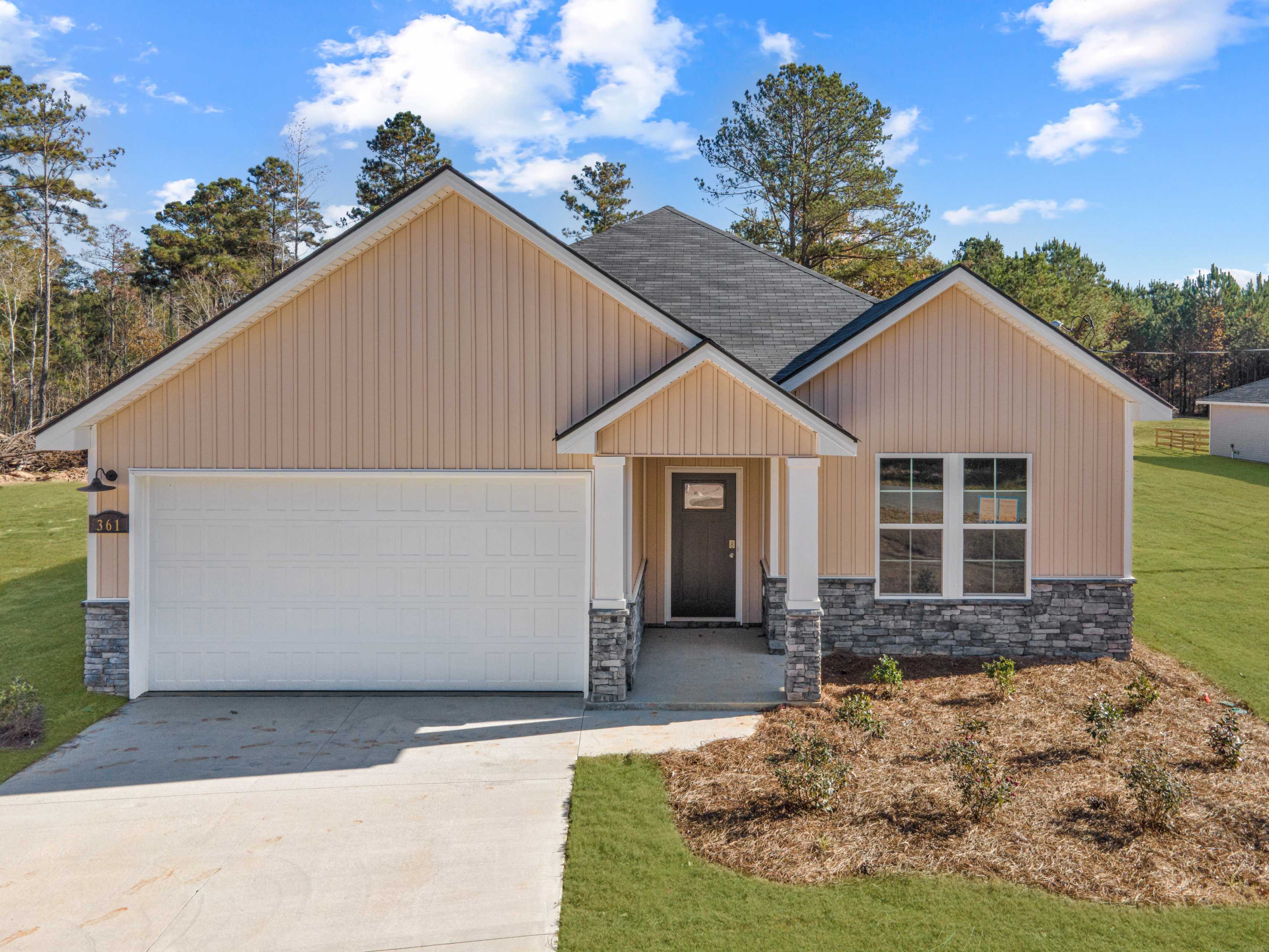 Aerial view of 1-story 4-bedroom The Orion home by Evermore Homes in Silver Oak, Cusseta, Alabama, amid pine woods