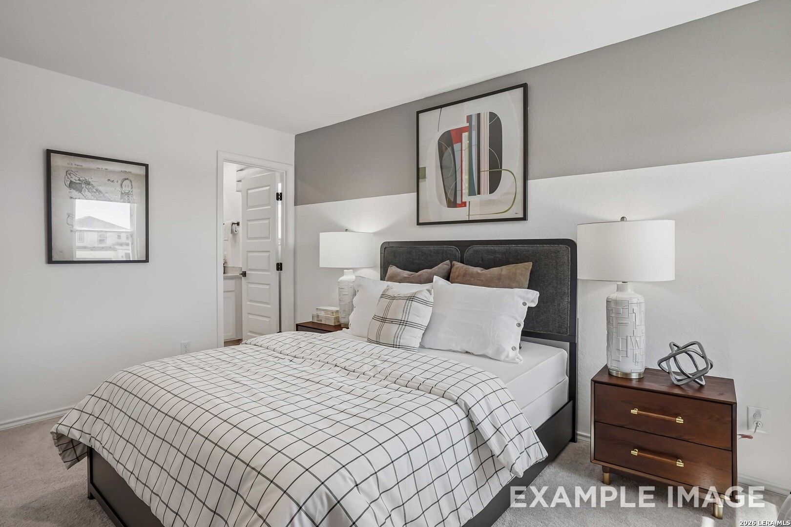 Cozy bedroom with dark upholstered headboard and wood nightstand in Davidson Homes Pinecrest E, Fairway Crossing, Converse, TX