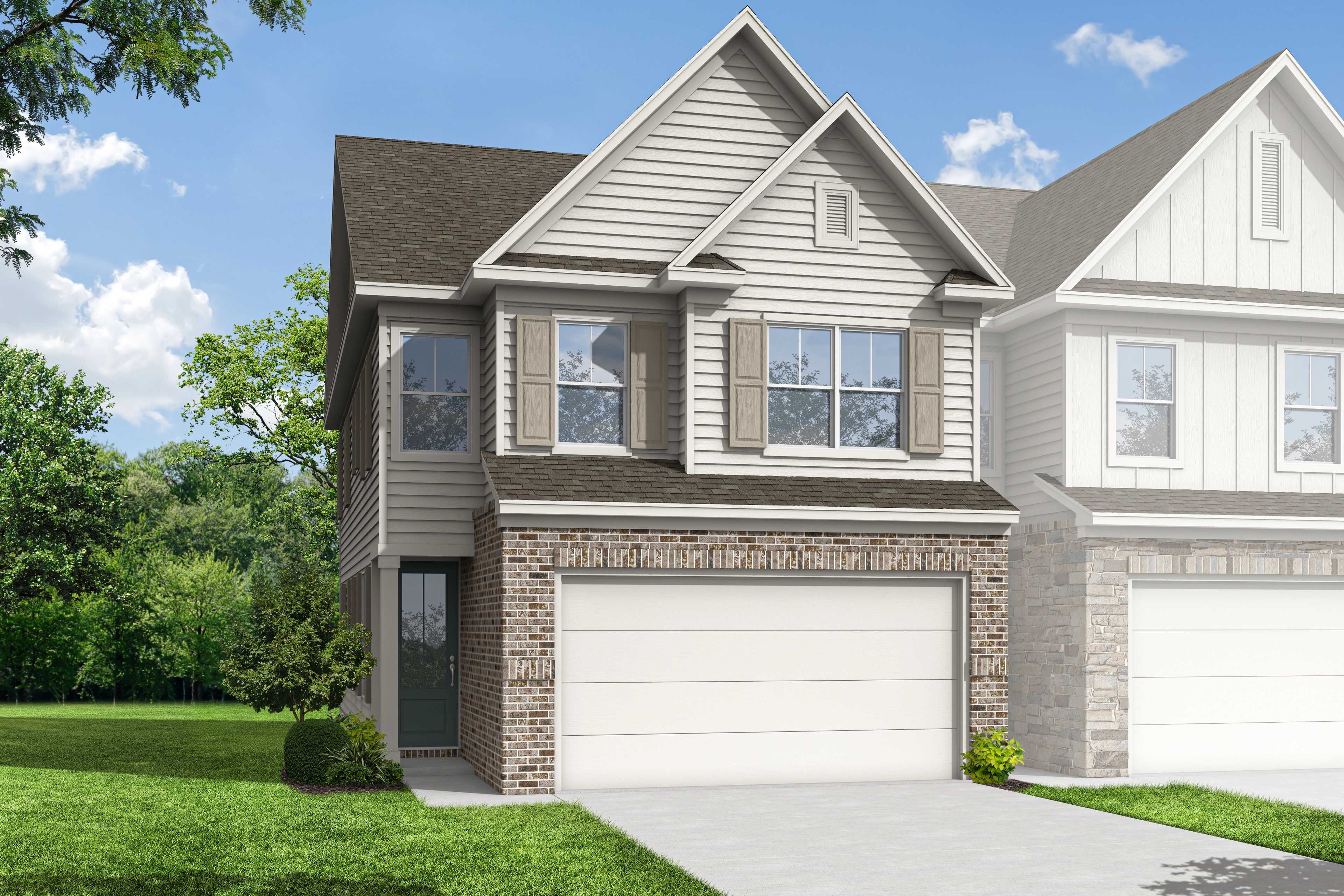Two-story multi-family duplex elevation of The Chatham C by Davidson Homes, featuring brick accents, siding, 2-car garages, and landscaped yard