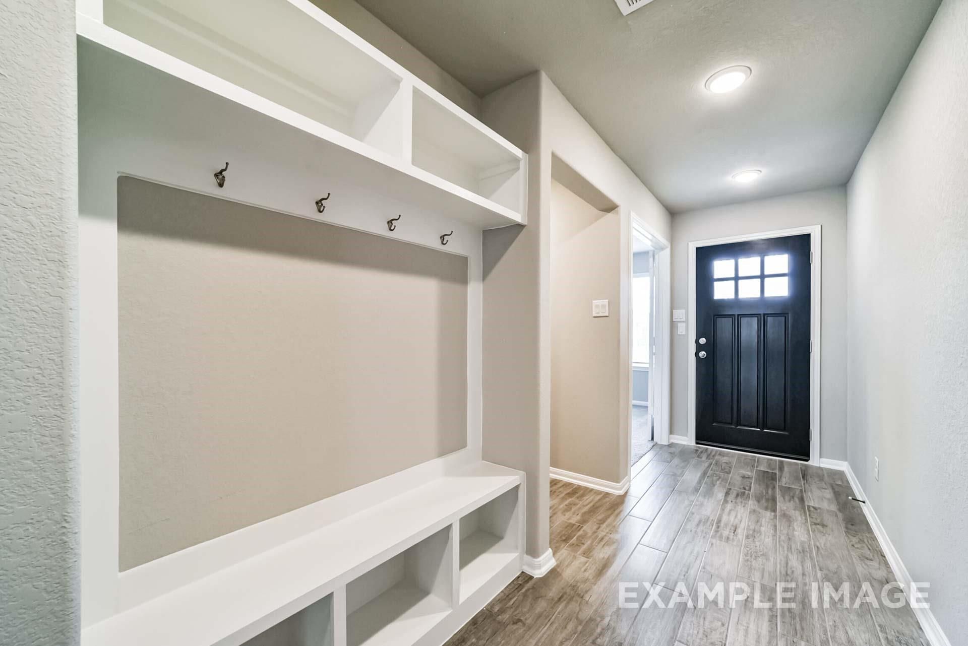 Built-in mudroom bench and storage in The Riviera A floor plan at Emberly in Beasley, Texas.