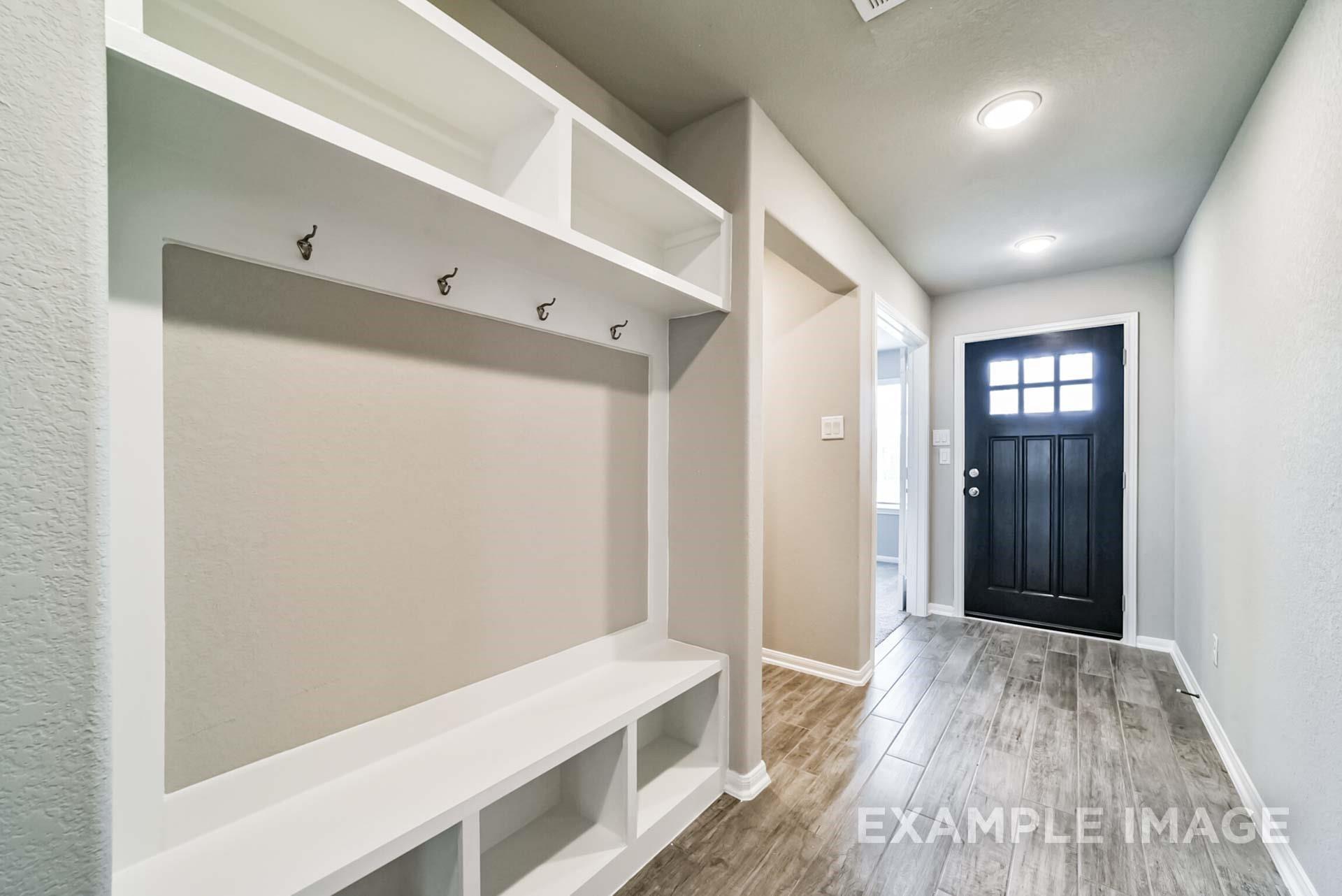 Built-in mudroom bench and storage in The Riviera A floor plan at Emberly in Beasley, Texas.