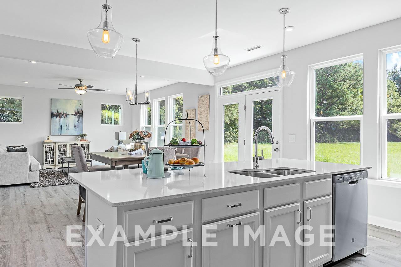 Davidson Homes The Chestnut Plan Kitchen Island overlooking the dining and living area