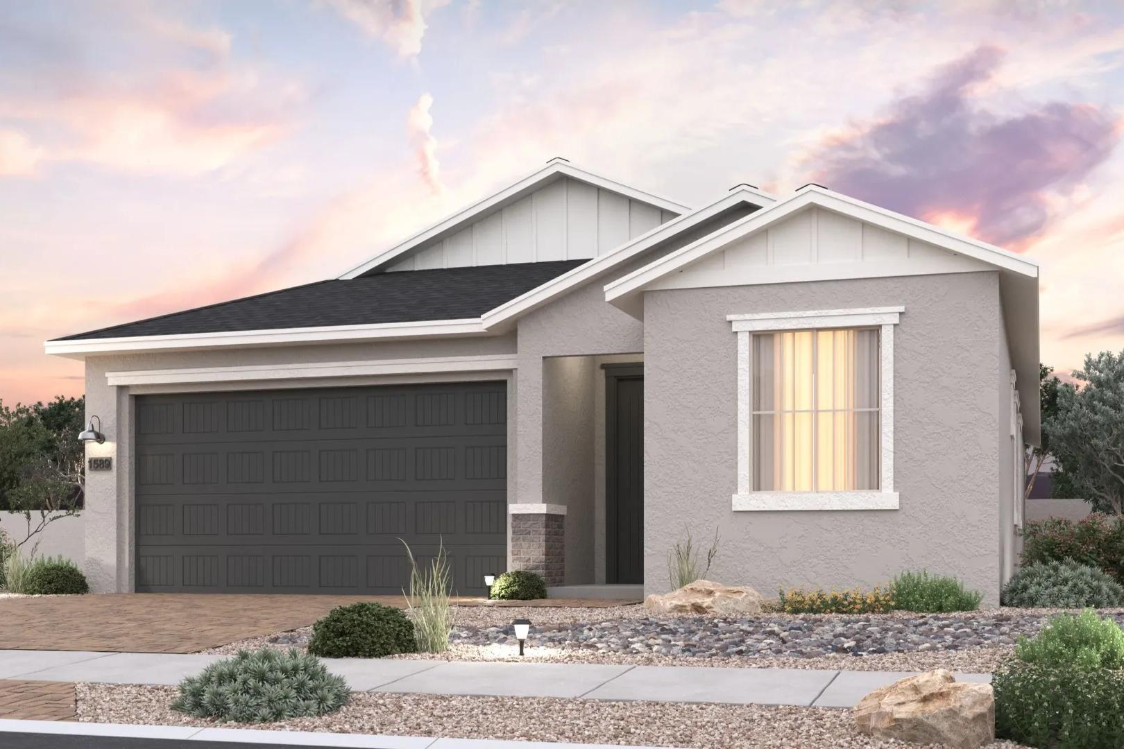 Modern ranch-style home exterior at North Ridge Pronghorn Ranch in Prescott Valley AZ with desert landscaping and sunset sky