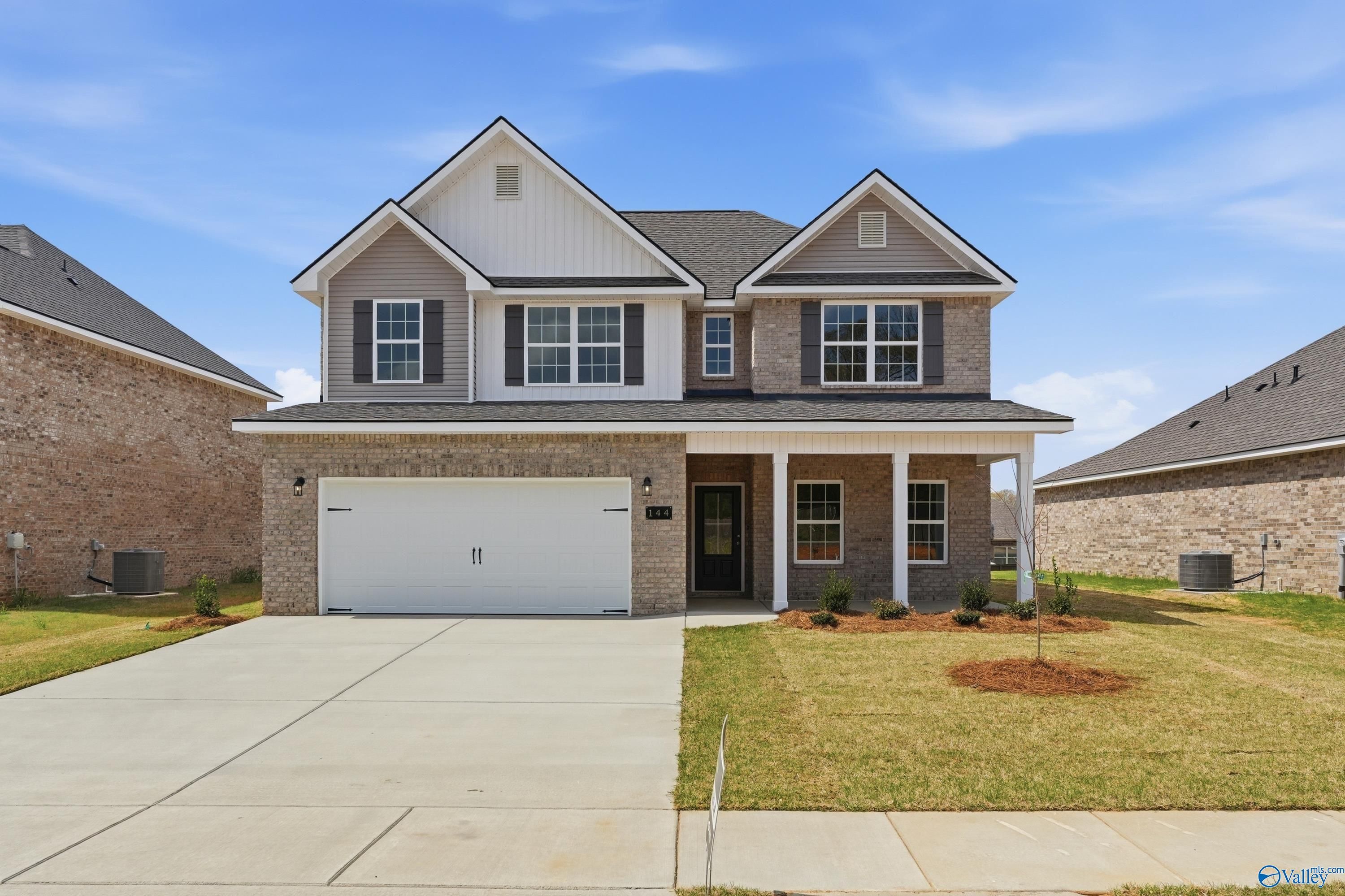 Modern two-story brick-accented home with 2-car garage, front porch, and driveway in Creek Grove, New Market, Alabama by Davidson Homes The Shelby B