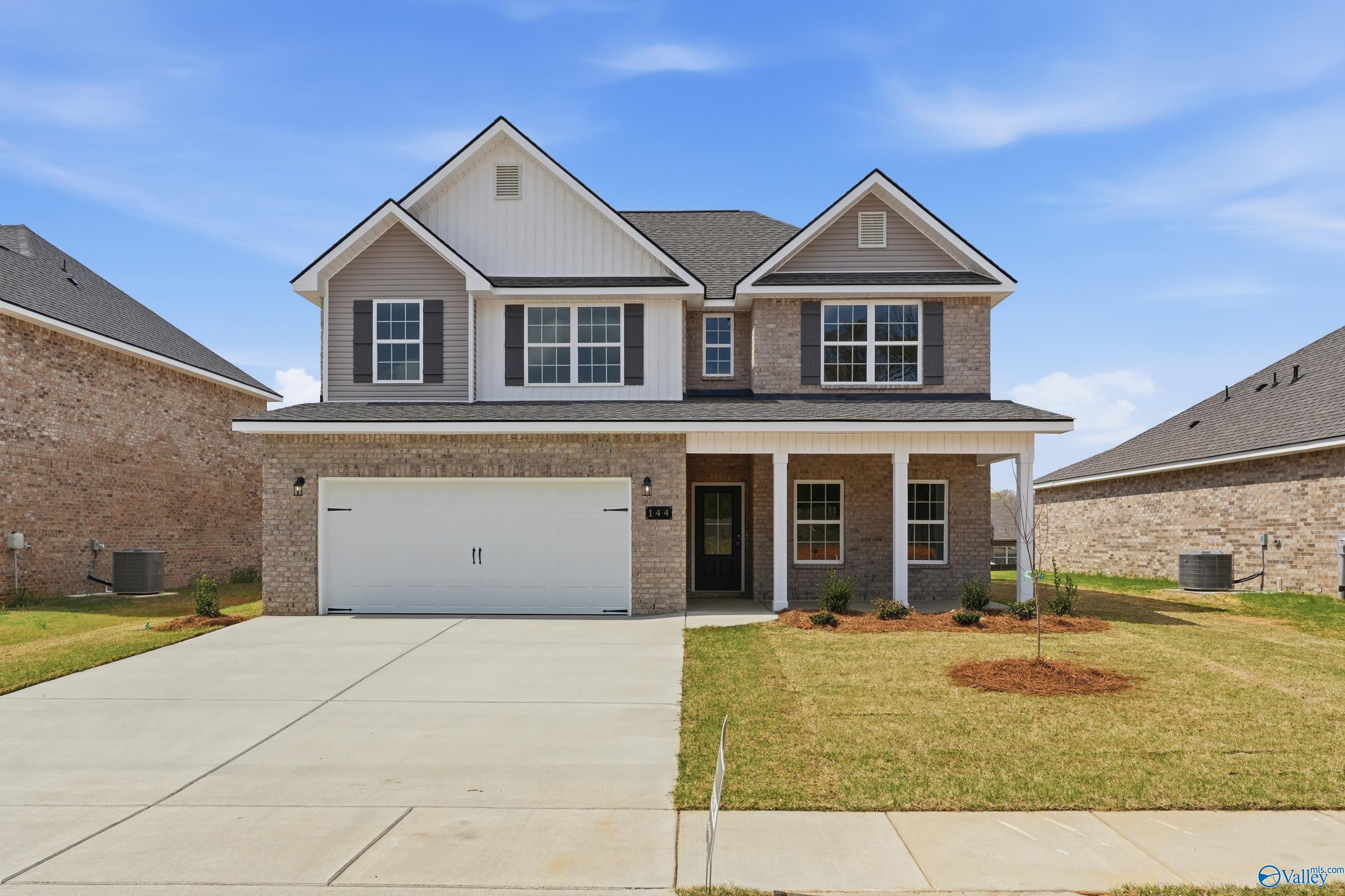 Modern two-story brick-accented home with 2-car garage, front porch, and driveway in Creek Grove, New Market, Alabama by Davidson Homes The Shelby B