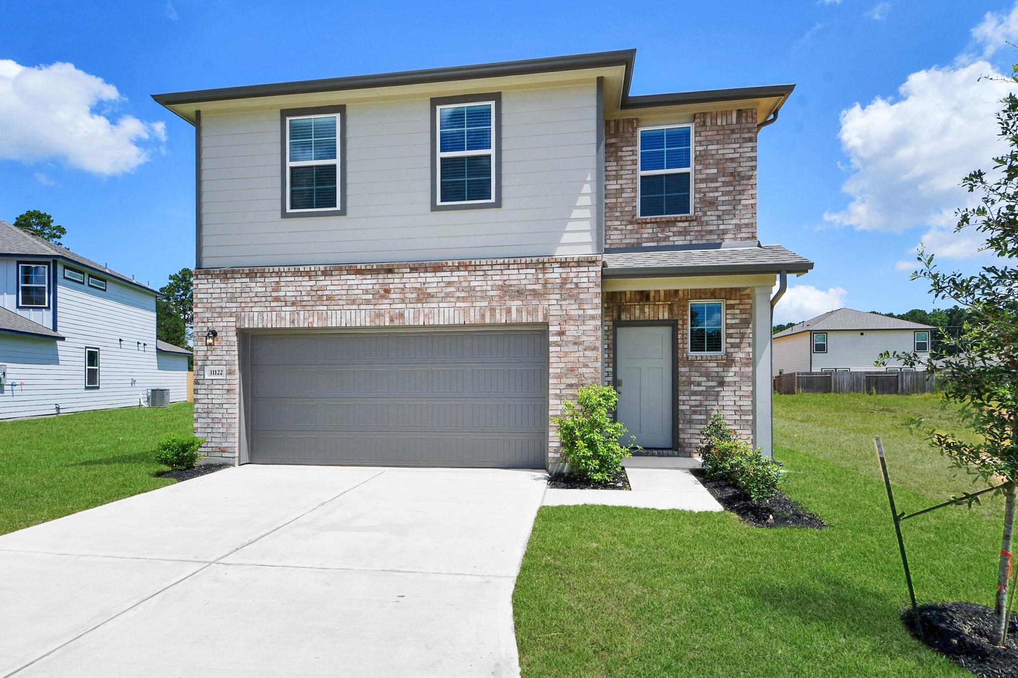Two-story 5-bedroom Brazos F floor plan by Davidson Homes with a 2-car garage in Liberty Estates, Cleveland, Texas.