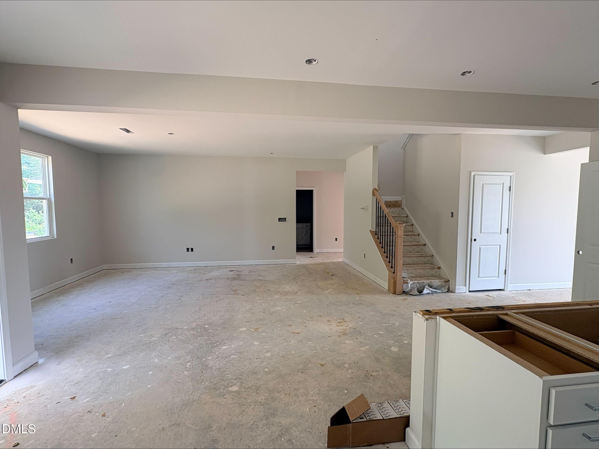 Open-concept living area under construction in The Willow C floor plan at Woodland Crossing in Zebulon, North Carolina.