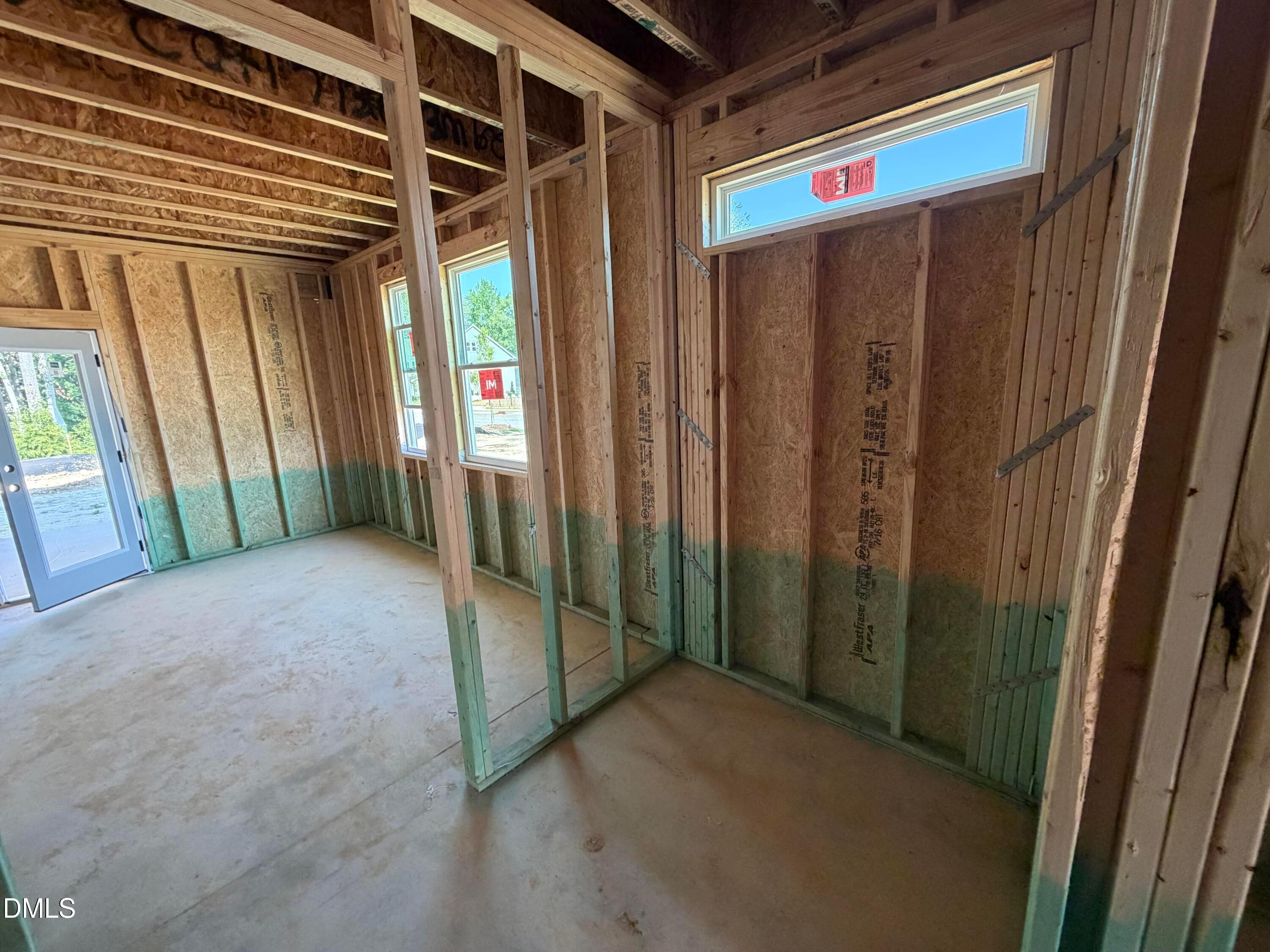 Wood framing and wall studs under construction for The Preston C floor plan at Wendell Ridge in Wendell, North Carolina.